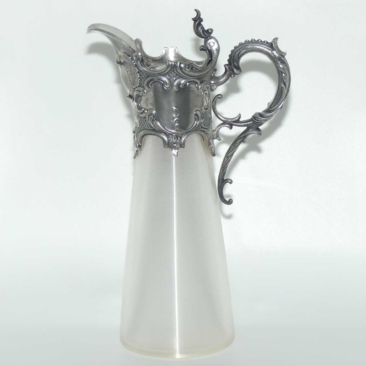 Late Victorian Brittania metal mounted threaded glass claret jug