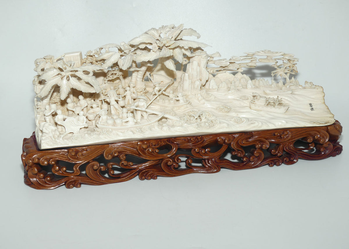 Magnificent Chinese Carved Ivory complex figure of Fishing Village on ornate wooden display stand | 42cm long