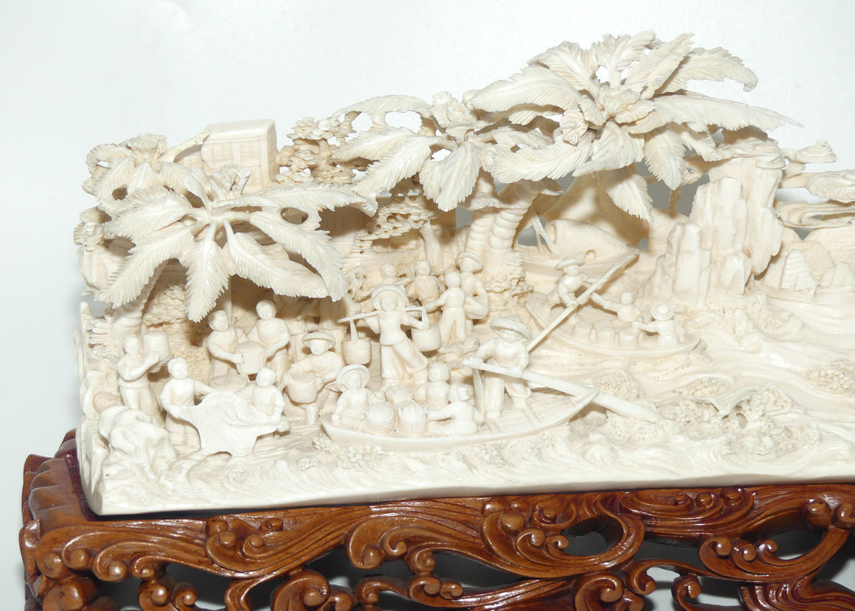 Magnificent Chinese Carved Ivory complex figure of Fishing Village on ornate wooden display stand | 42cm long