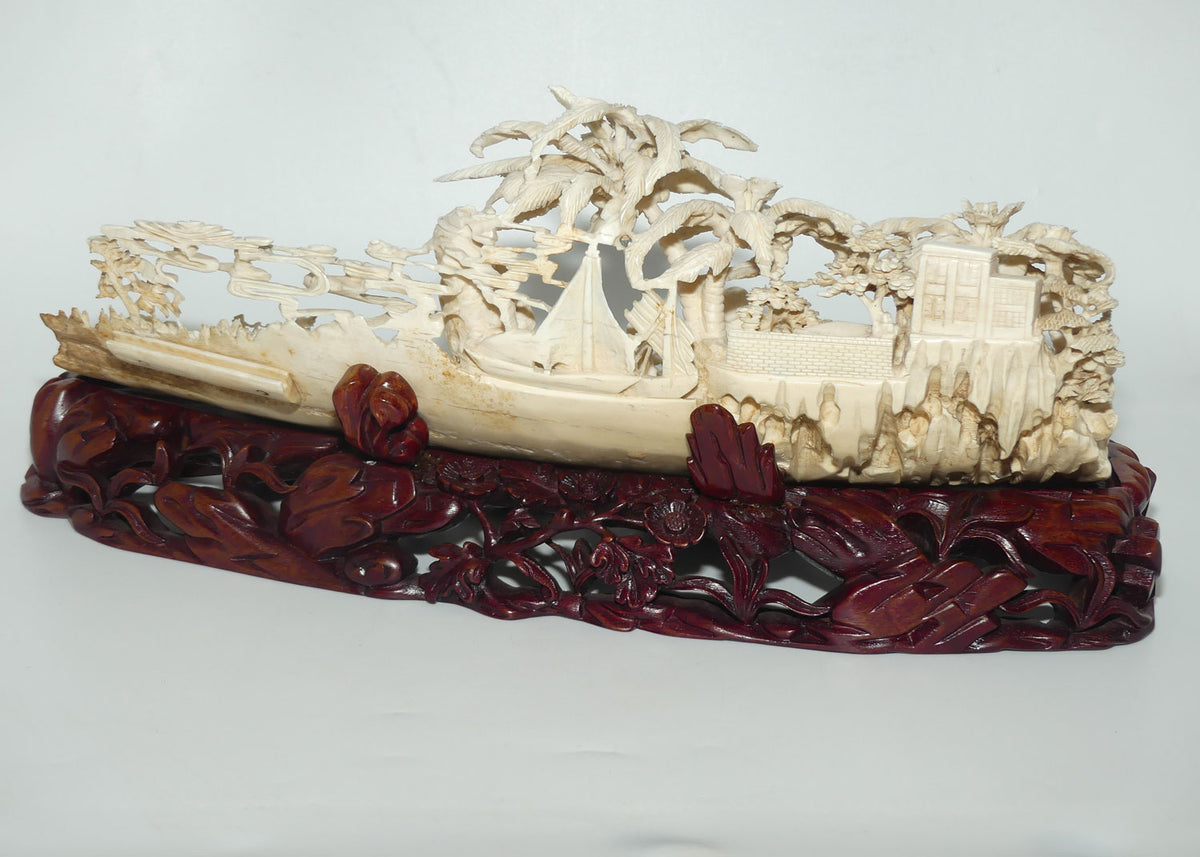 Magnificent Chinese Carved Ivory complex figure of Fishing Village on ornate wooden display stand | 42cm long