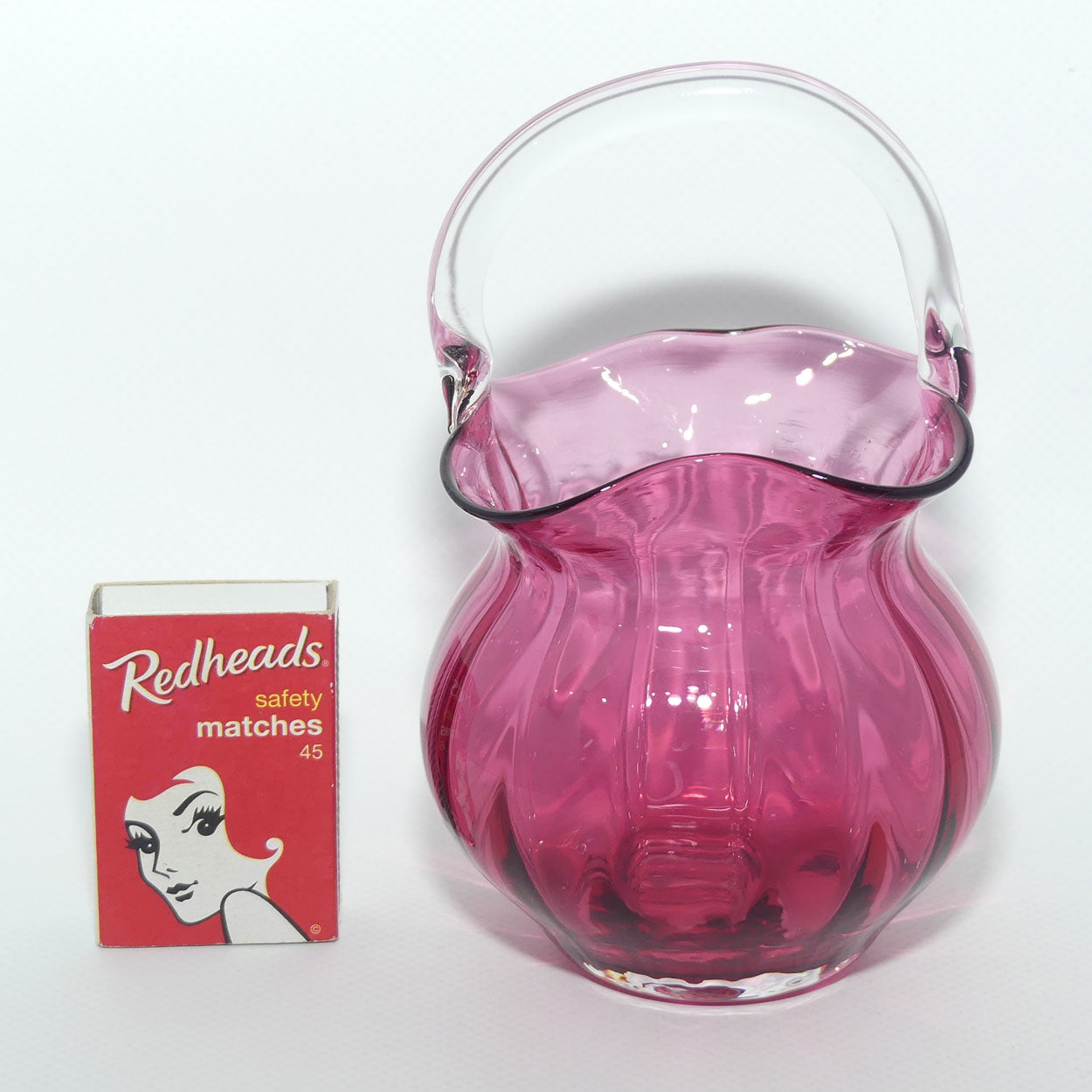 Small Cranberry Glass basket with clear glass handle