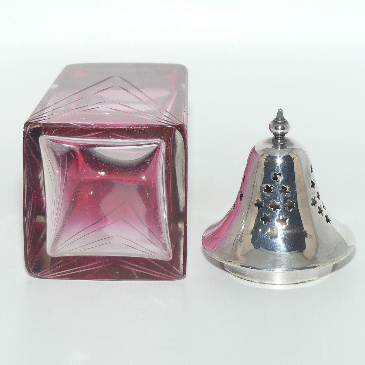 Victorian era Cranberry Glass with facetted design sugar castor | EPNS lid