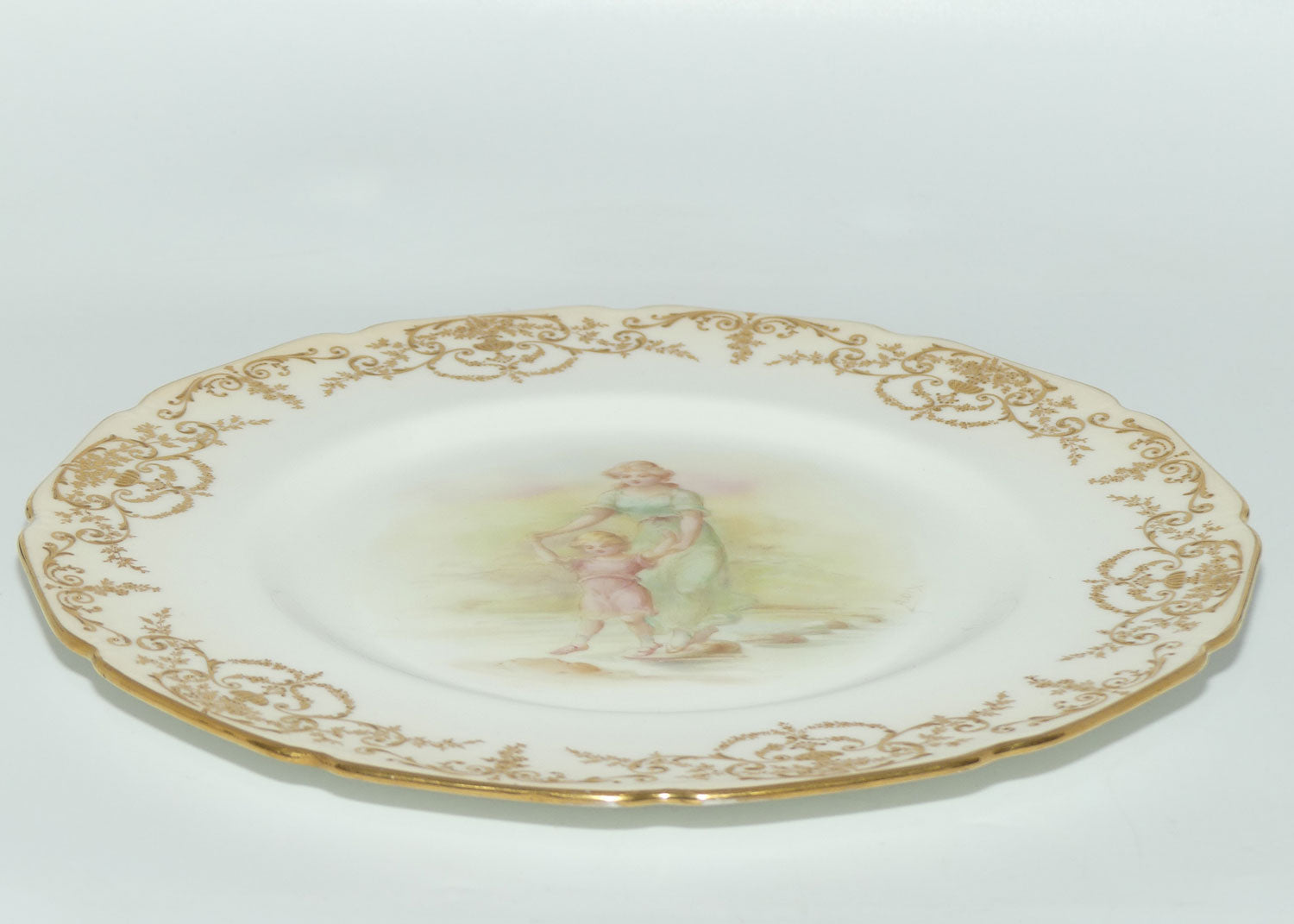 Royal Doulton hand painted and gilt Young woman and Child walking over stepping stones plate (Dix)
