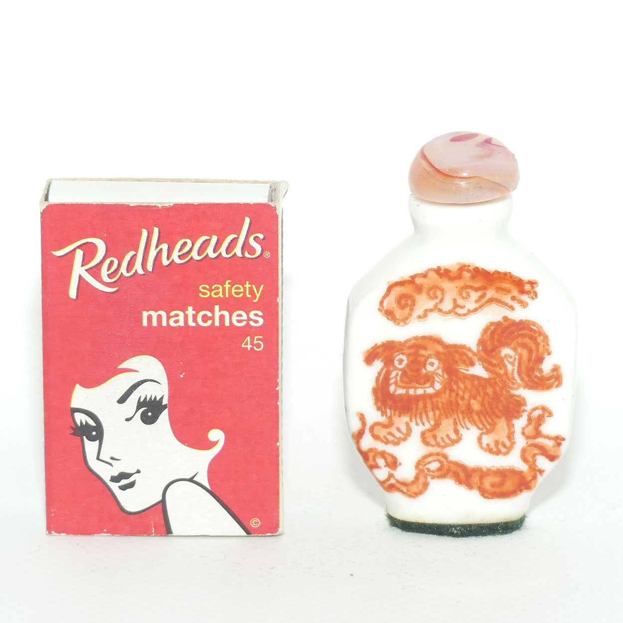 Chinese snuff bottle with red stone stopper | Dog of Fo