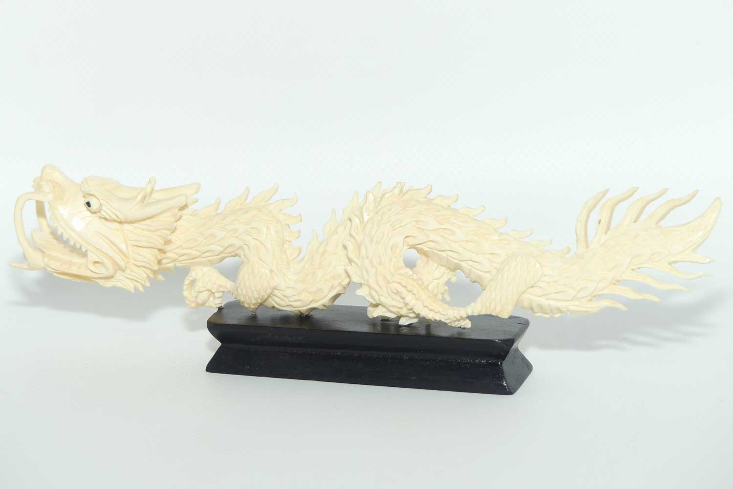 Carved Ivory figure of Dragon on Wooden base | 20cm long