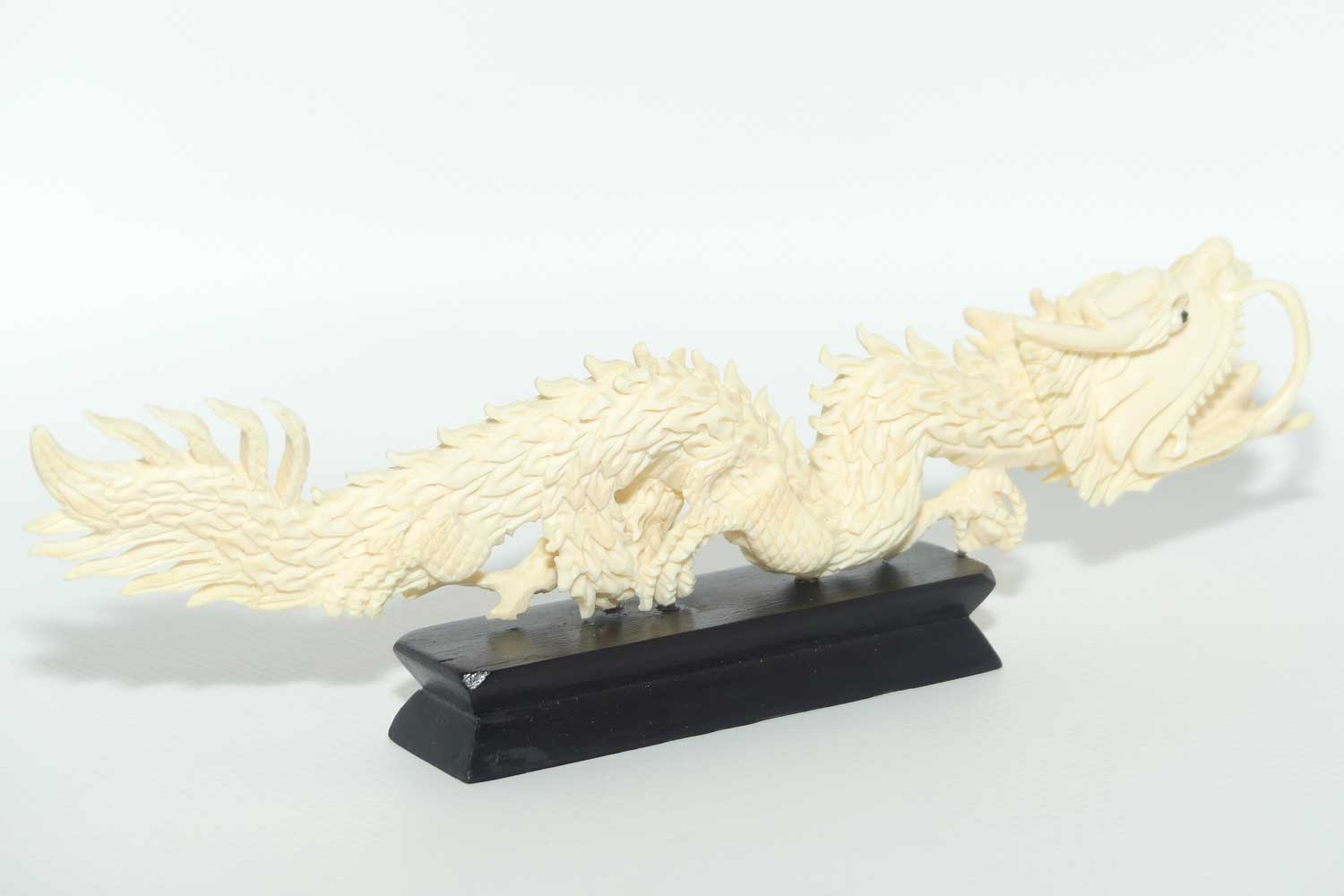 Carved Ivory figure of Dragon on Wooden base | 20cm long