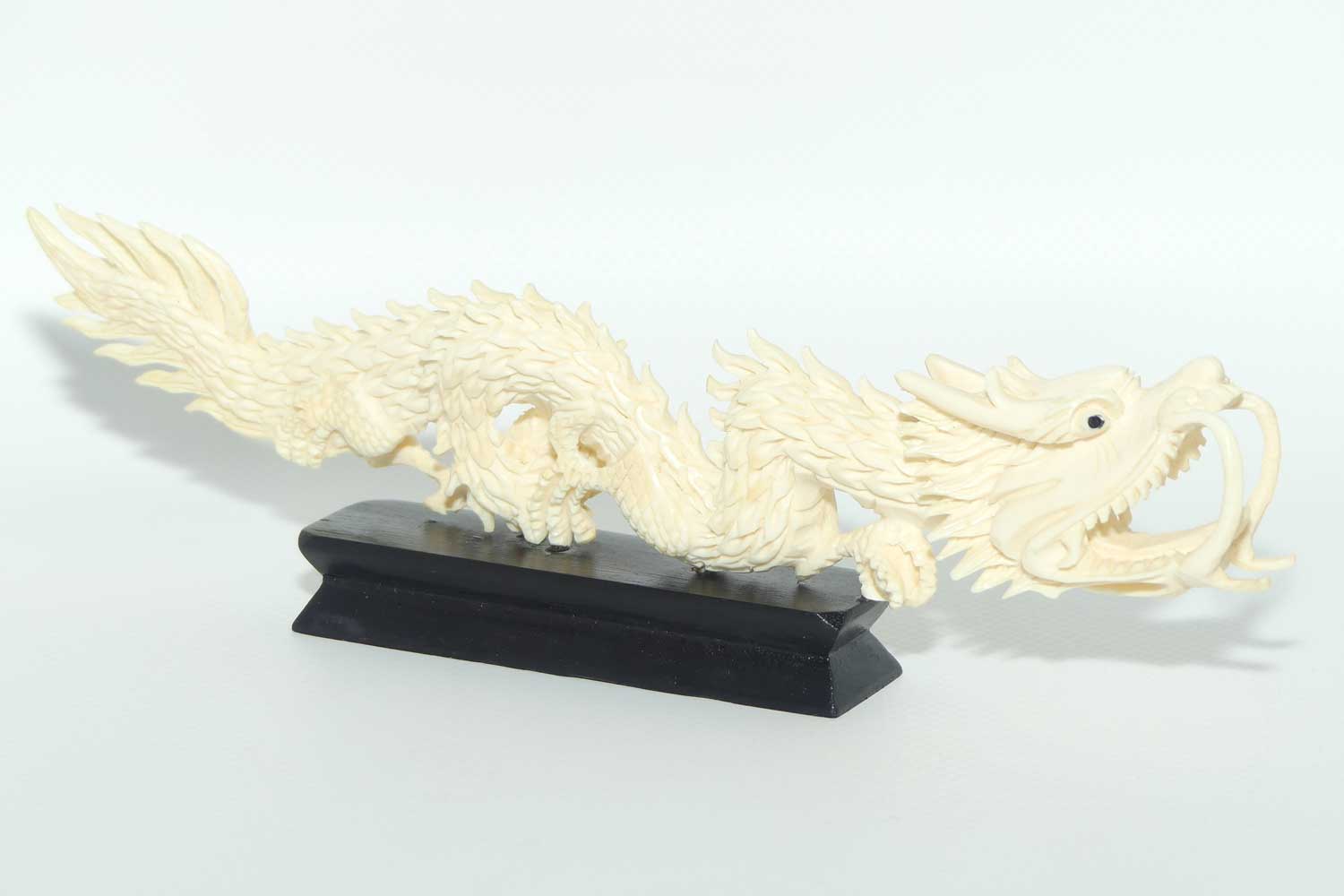 Carved Ivory figure of Dragon on Wooden base | 20cm long