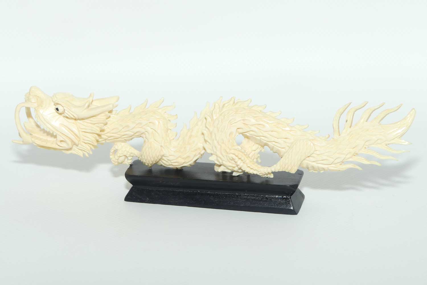 Carved Ivory figure of Dragon on Wooden base | 20cm long