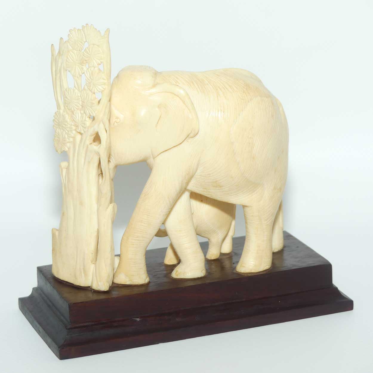 Carved Ivory figure of Mother Elephant and Calf on Rosewood Base