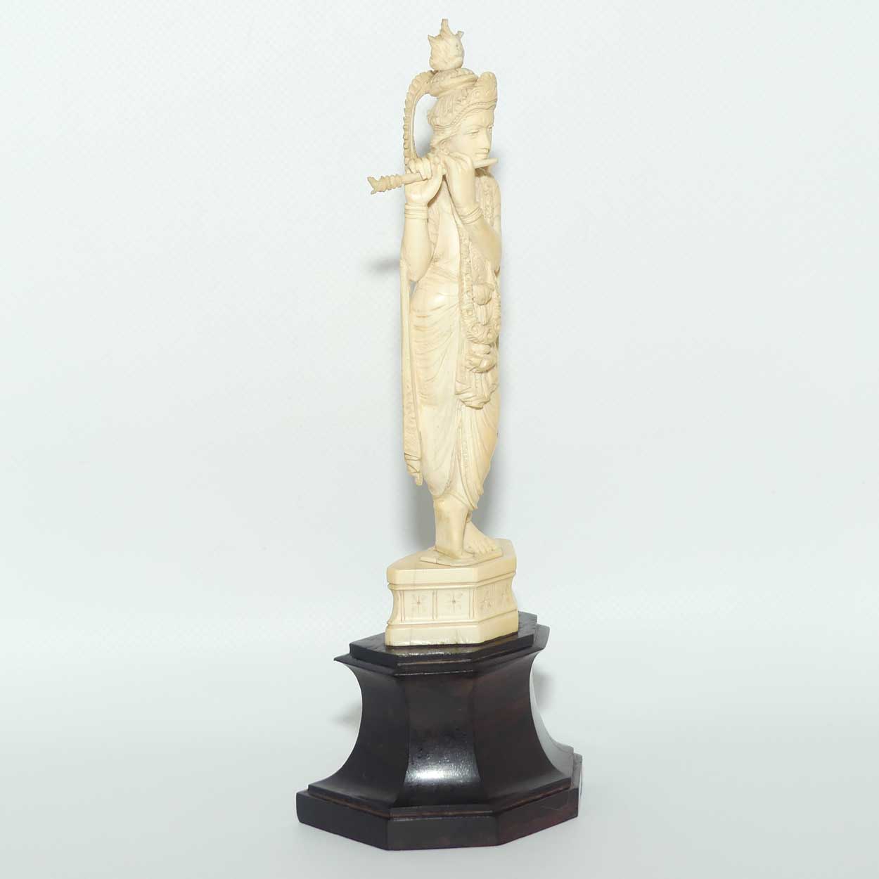 Carved Ivory figure of Hindi Deity Lord Krishna playing a Flute