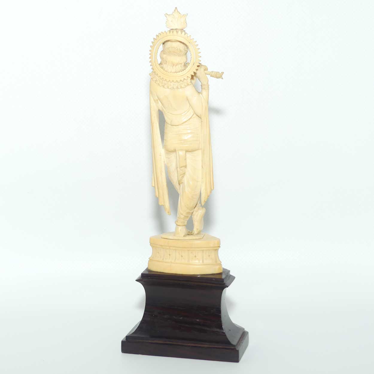 Carved Ivory figure of Hindi Deity Lord Krishna playing a Flute
