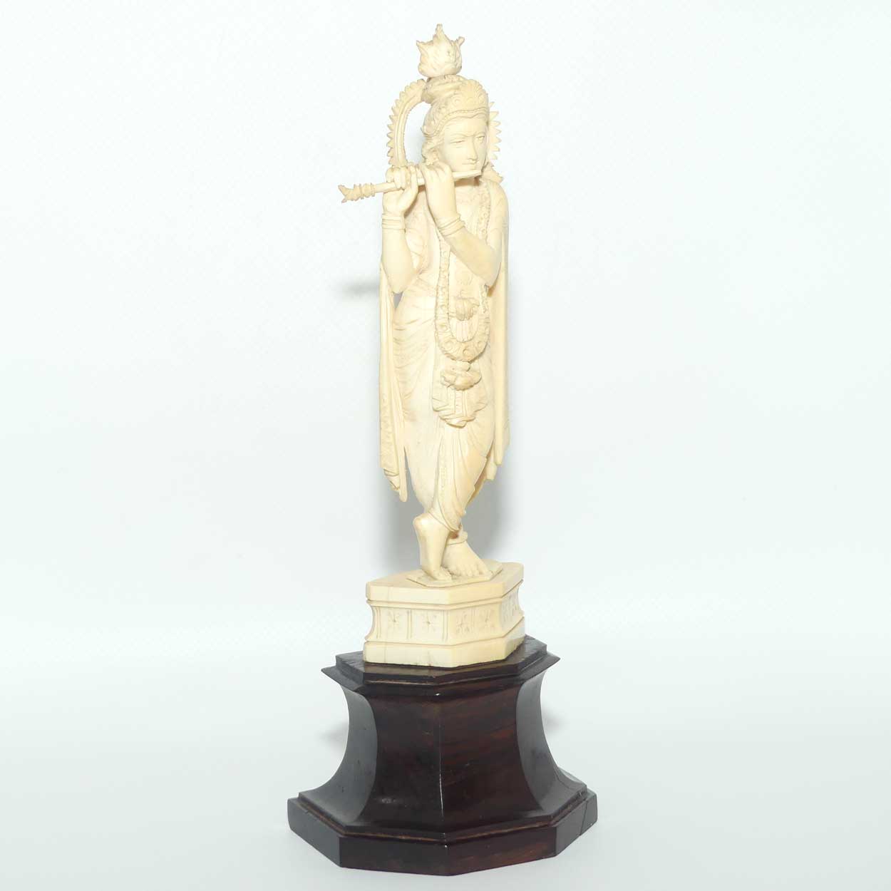 Carved Ivory figure of Hindi Deity Lord Krishna playing a Flute