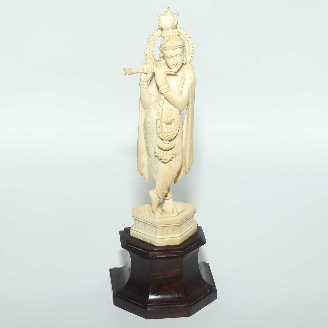 Carved Ivory figure of Hindi Deity Lord Krishna playing a Flute