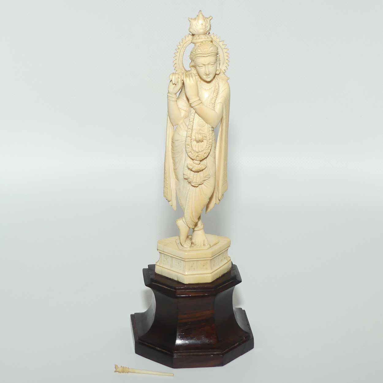 Carved Ivory figure of Hindi Deity Lord Krishna playing a Flute