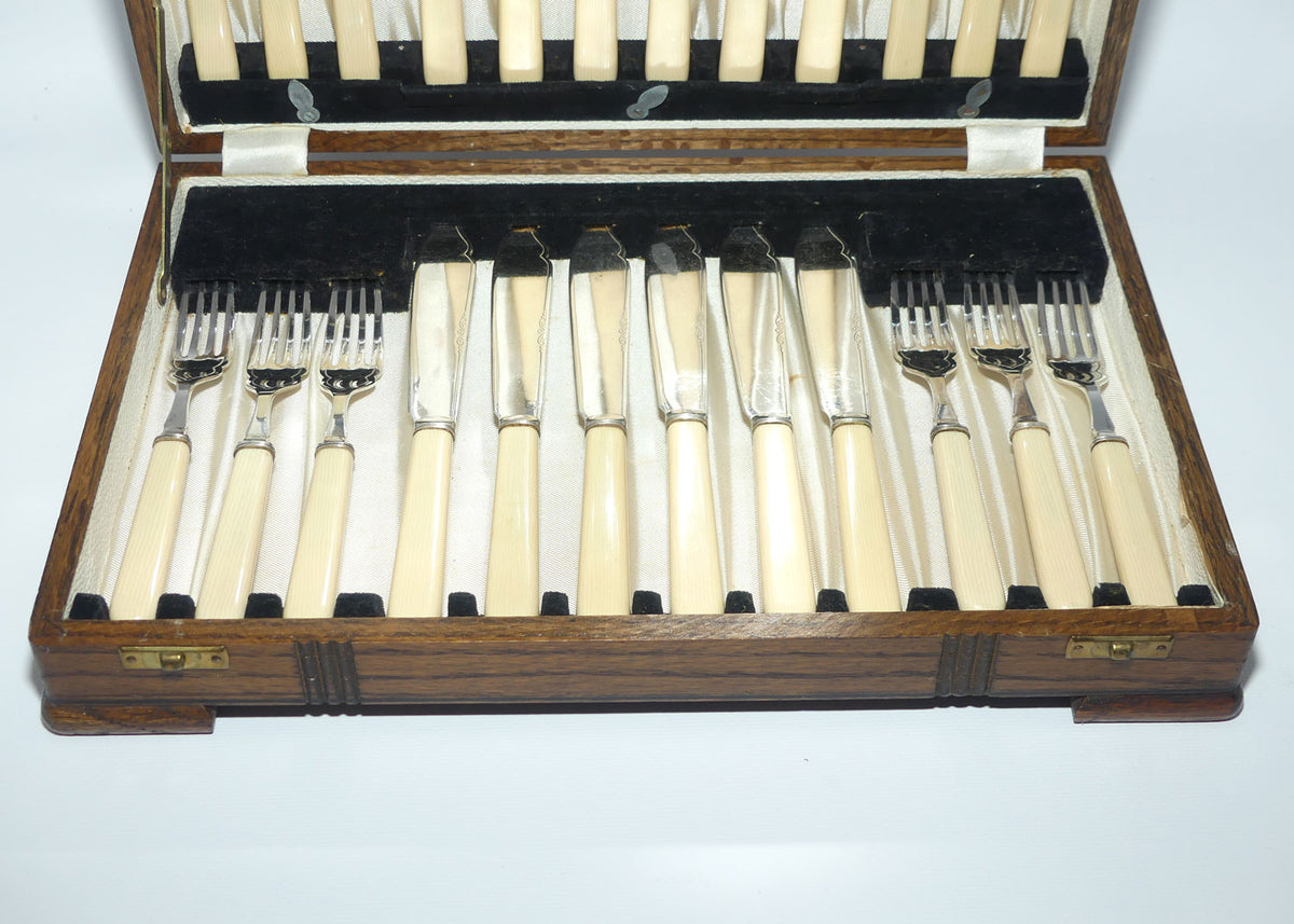 Edwardian era Bone handled and EPNS blades set of 12 fish eaters in Oak canteen