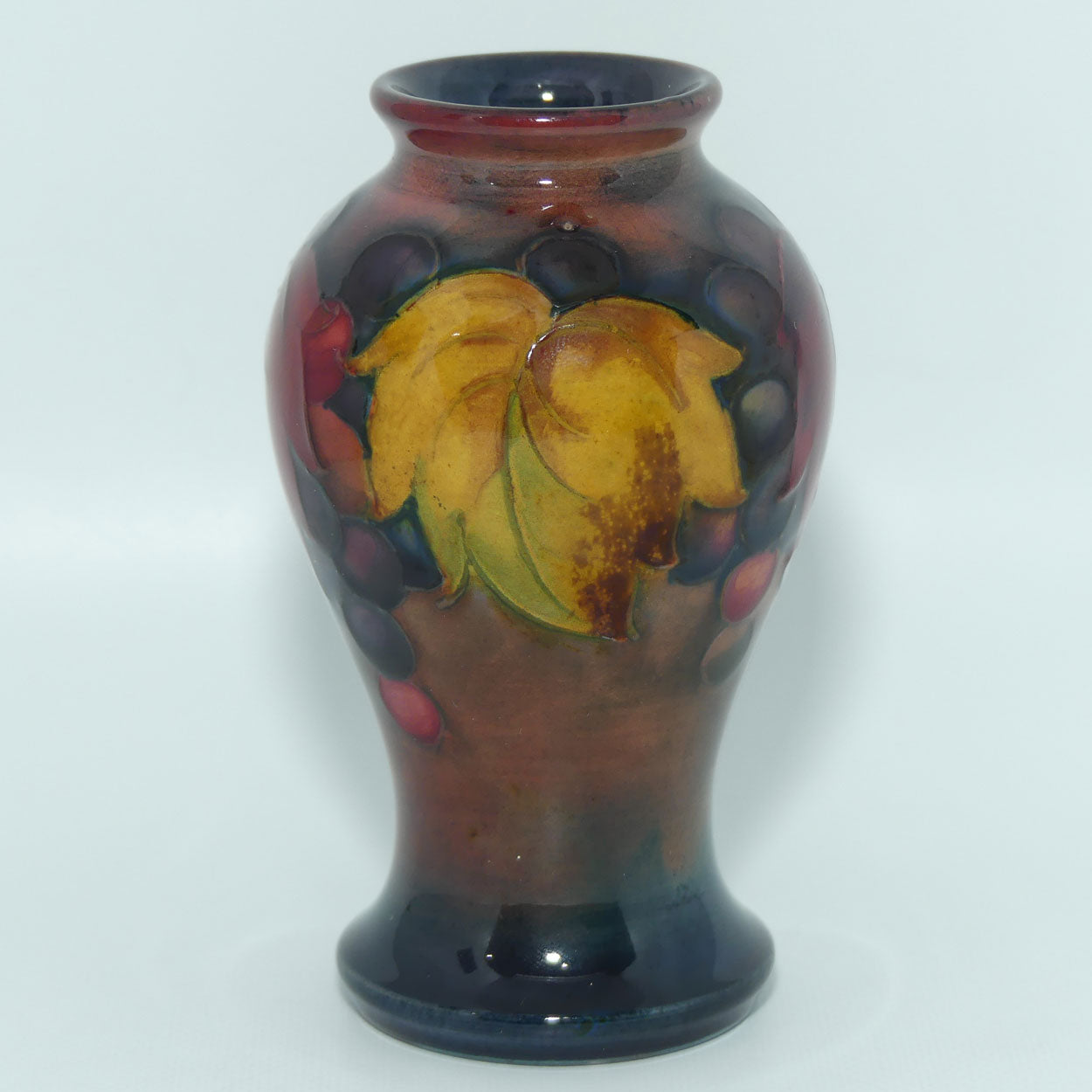 William Moorcroft Flambe Leaves and Fruit miniature vase