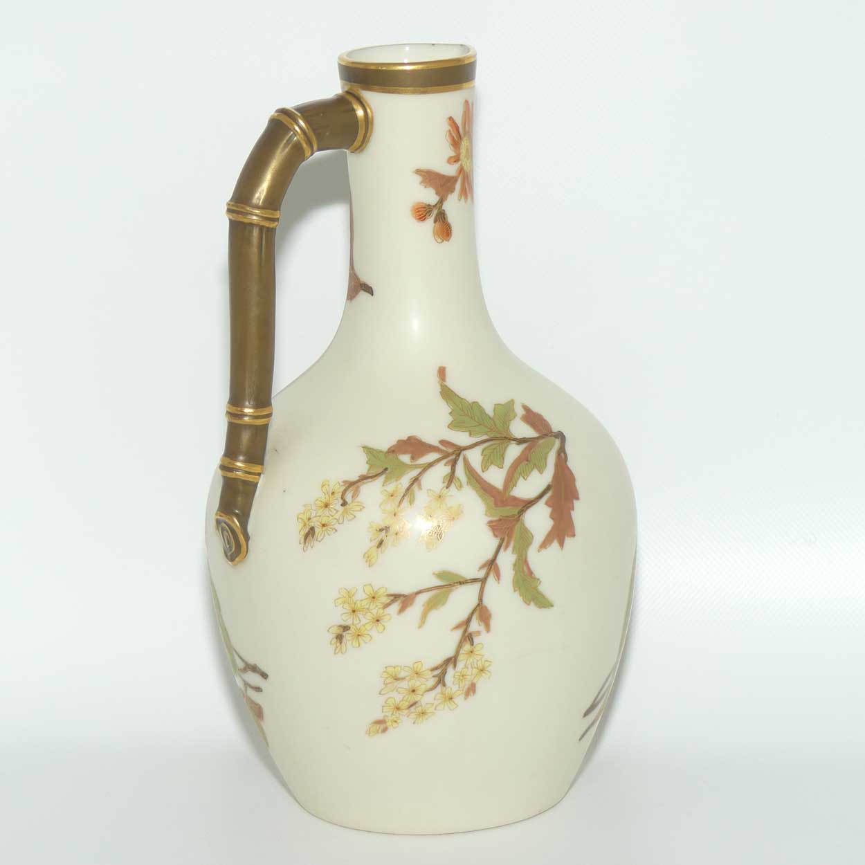 Royal Worcester Blush Ivory and gilt hand painted floral jug with bamboo style handle