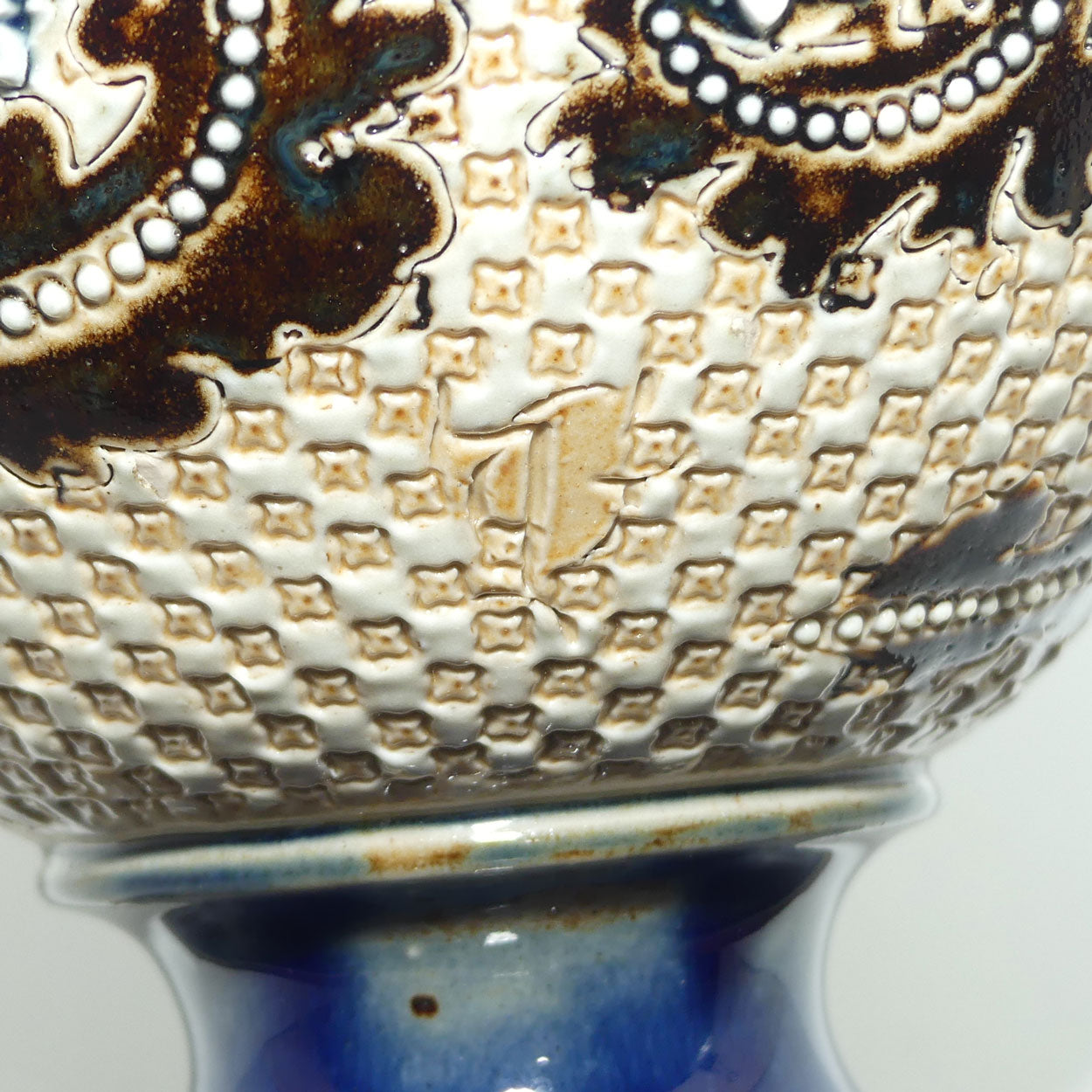 Doulton Lambeth George Tinworth footed base vase (Brown and Blue)