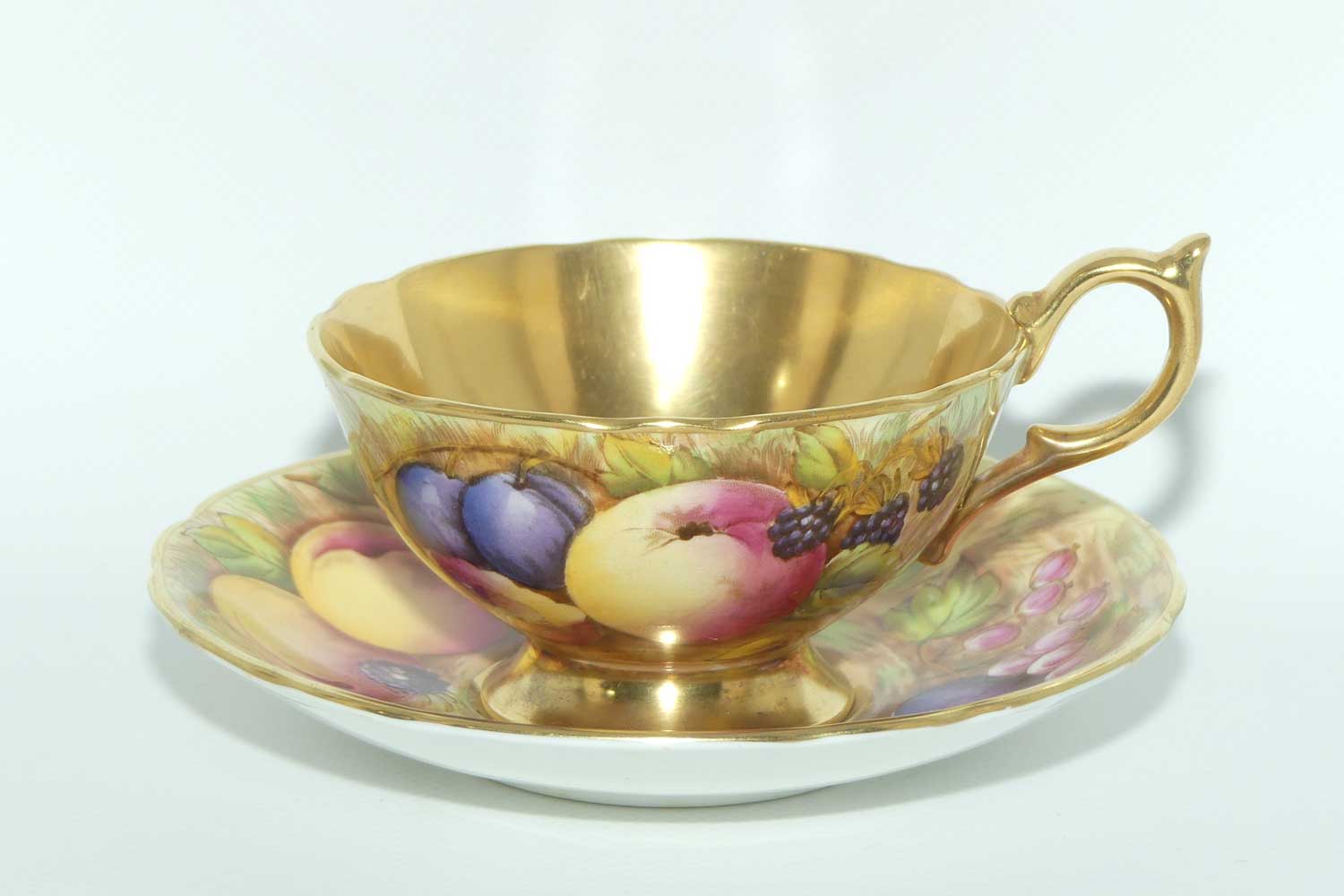 Aynsley Orchard Gold with gilt interior tea duo | signed Jones and Bru