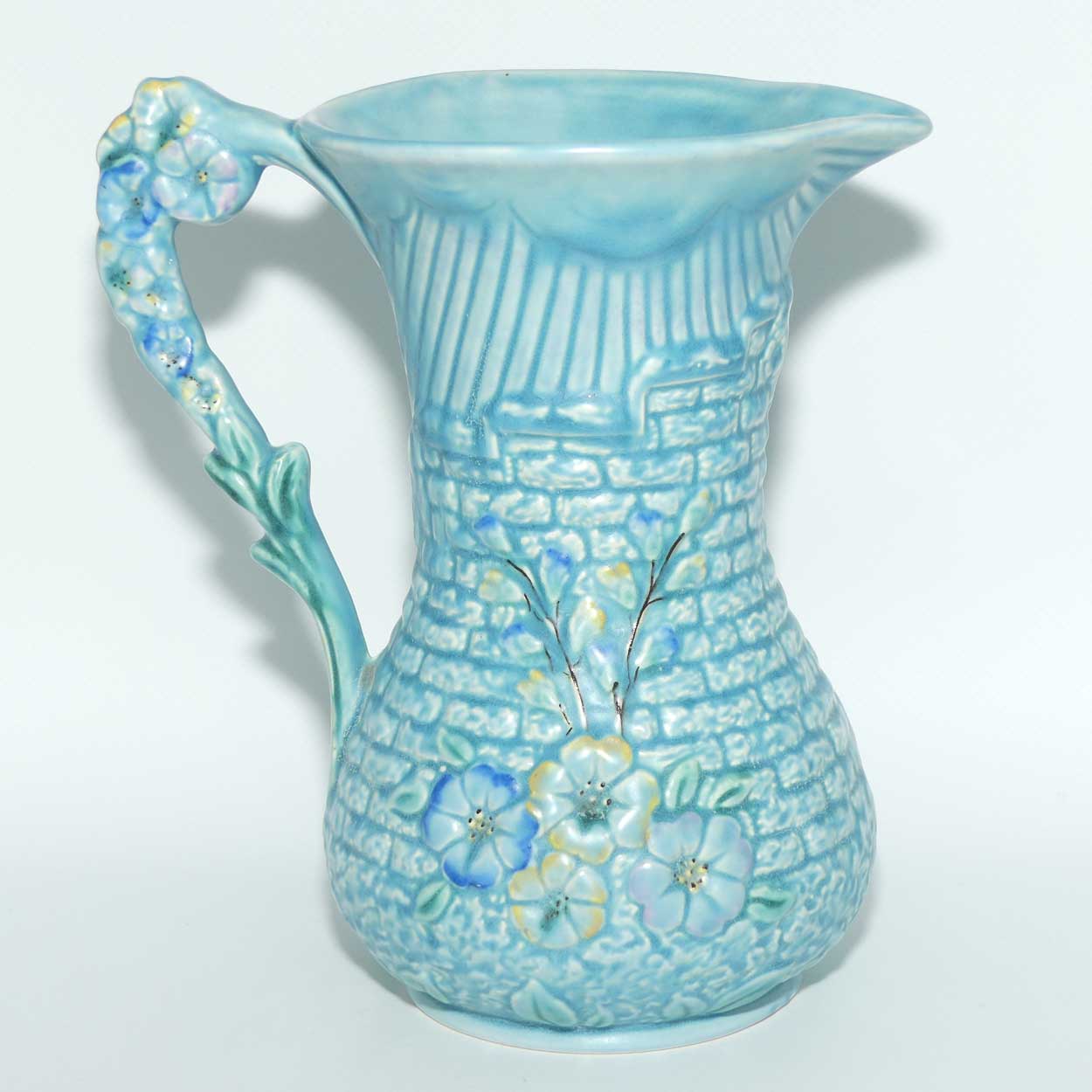 Arthur Woods Garden Wall floral embossed jug | Matt blue Glaze