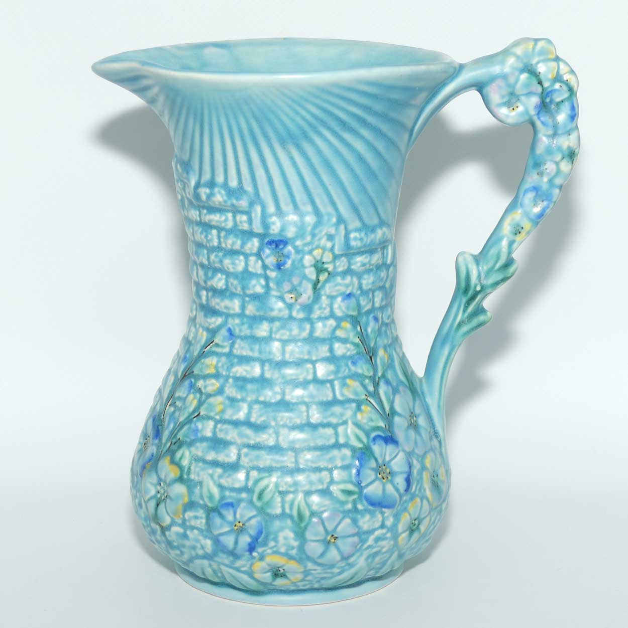 Arthur Woods Garden Wall floral embossed jug | Matt blue Glaze