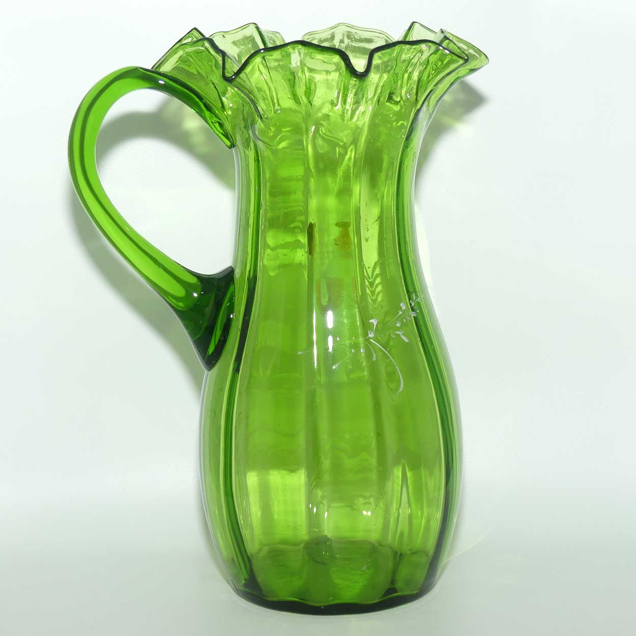 Green Mary Gregory crimped rim glass jug depicting a young girl sitting on bench