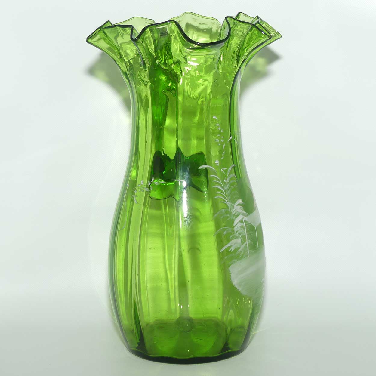 Green Mary Gregory crimped rim glass jug depicting a young girl sitting on bench