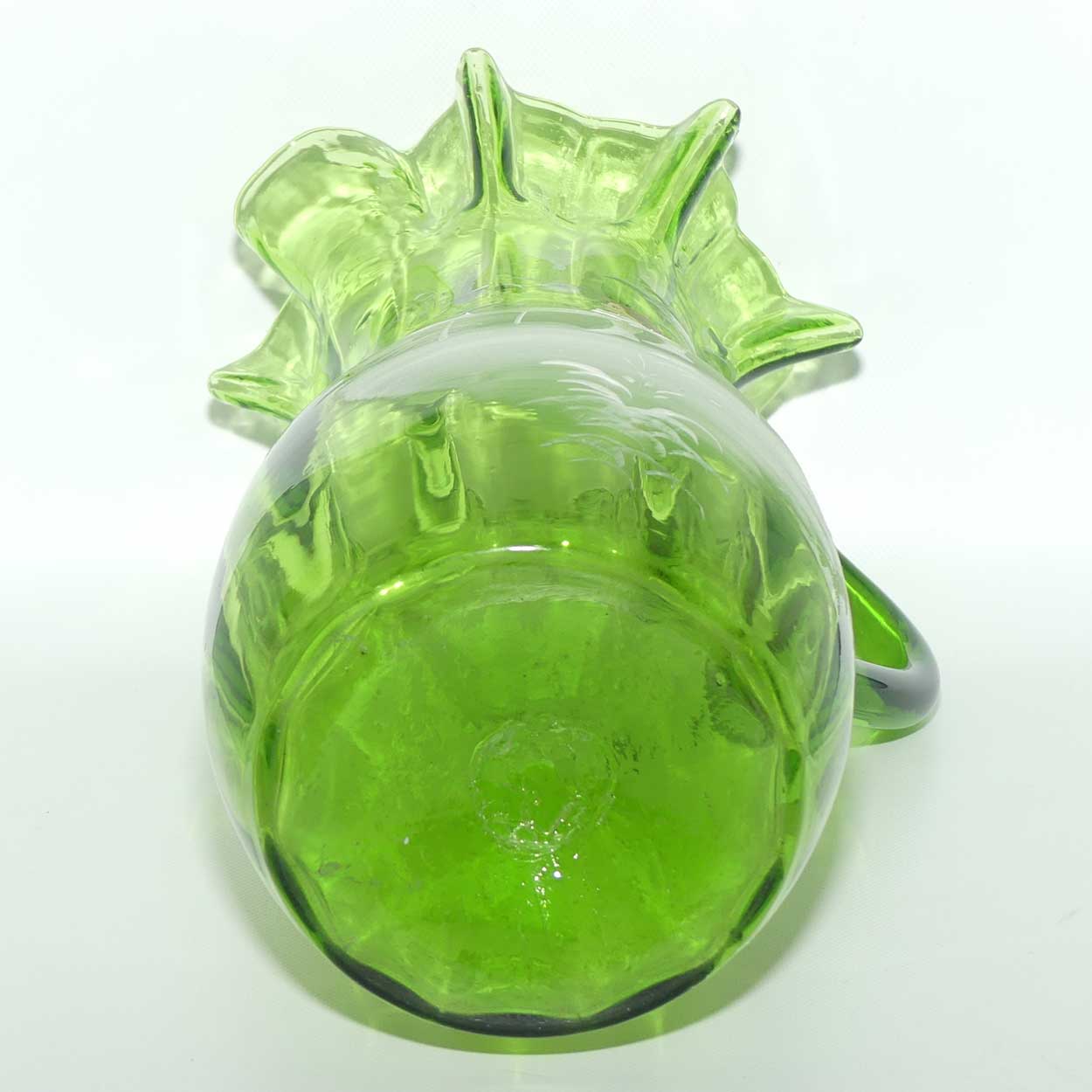 Green Mary Gregory crimped rim glass jug depicting a young girl sitting on bench