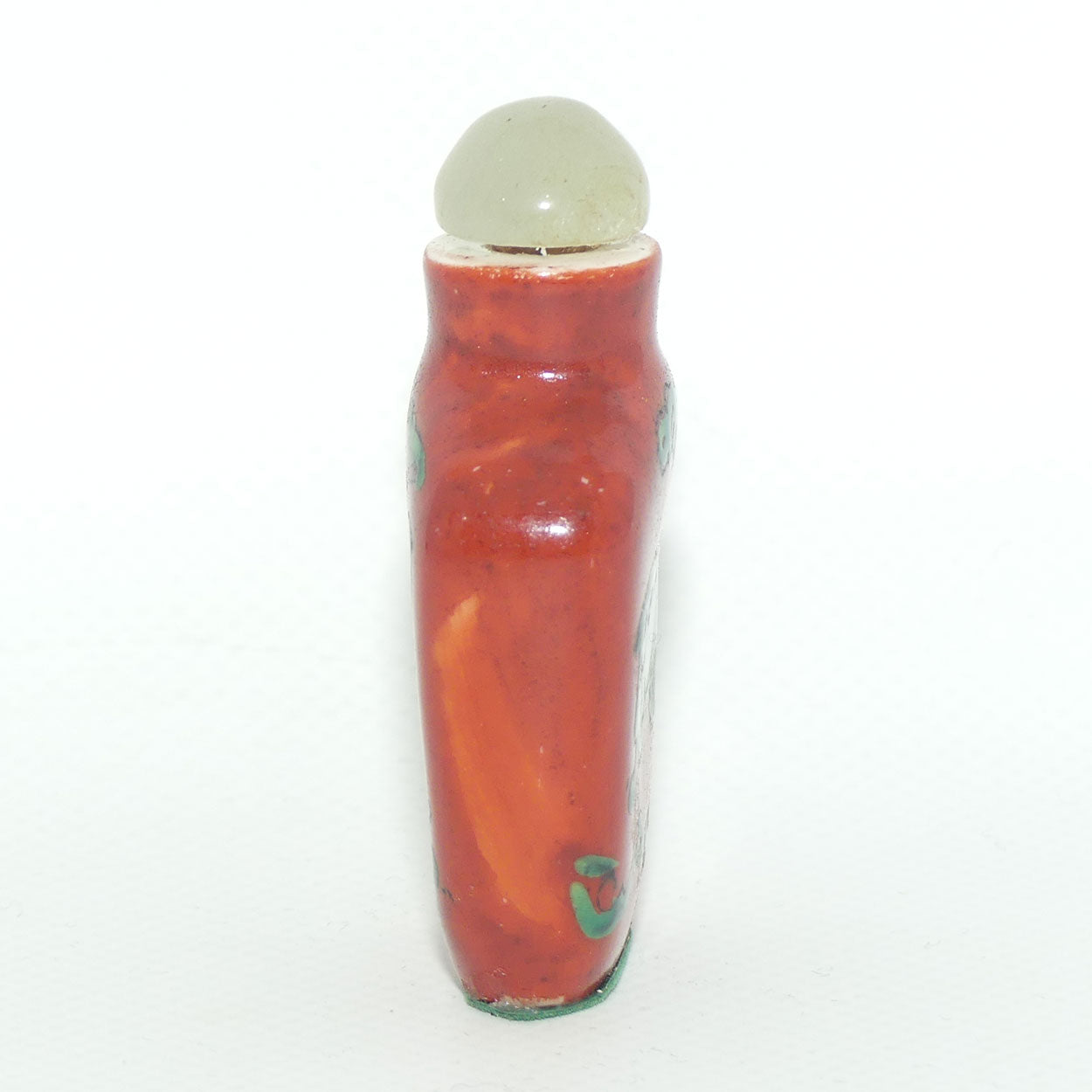 Chinese snuff bottle with greenstone stopper | Iron Red decorated with Dog of Fo