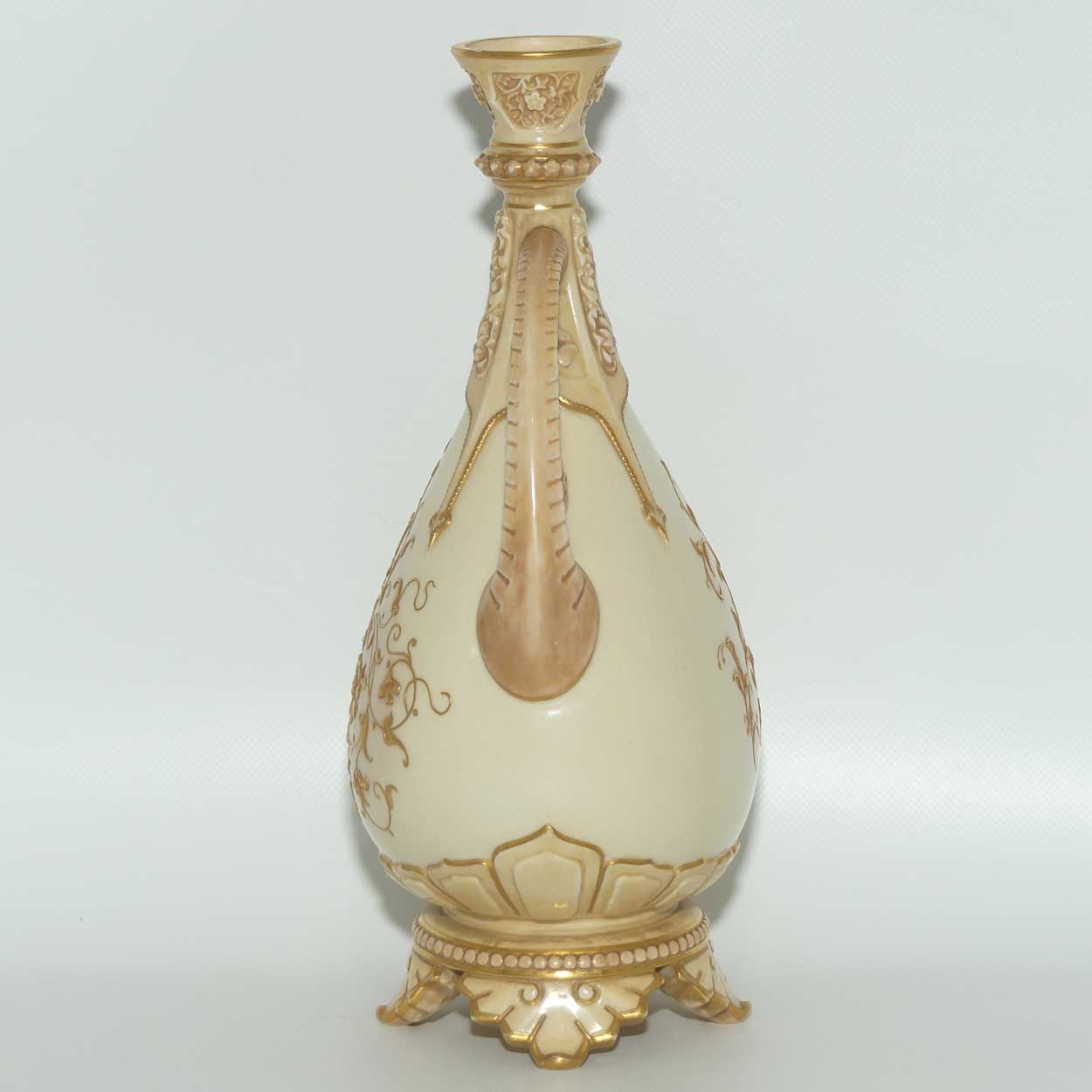Royal Worcester Blush Ivory heavily gilt handled vase on quad feet