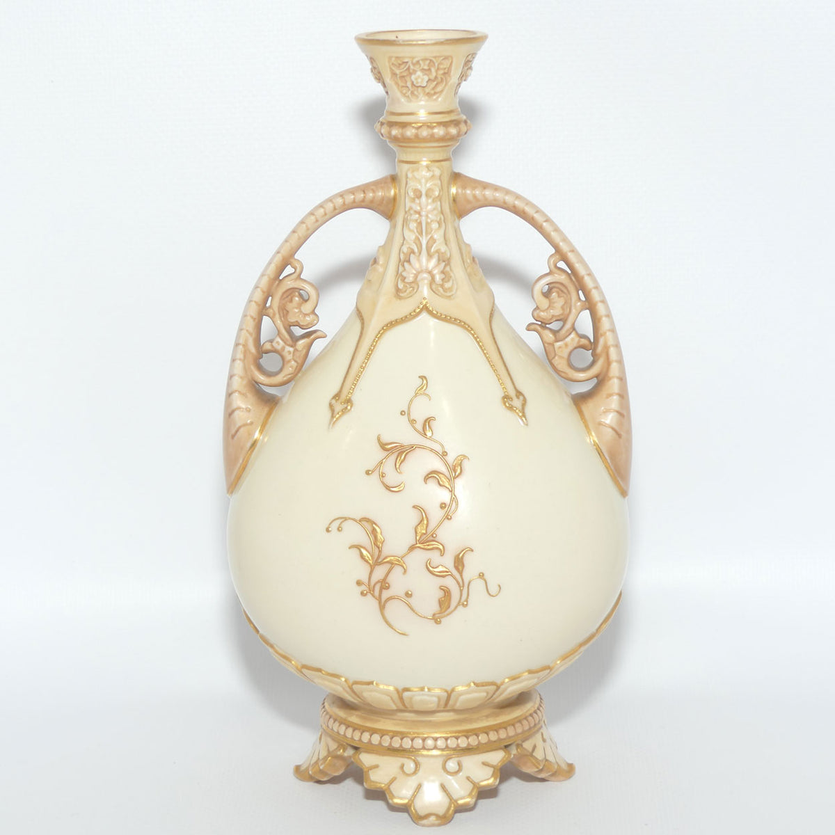 Royal Worcester Blush Ivory heavily gilt handled vase on quad feet