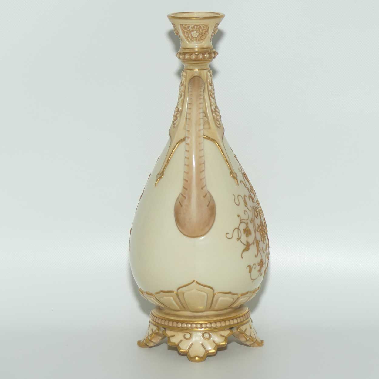 Royal Worcester Blush Ivory heavily gilt handled vase on quad feet