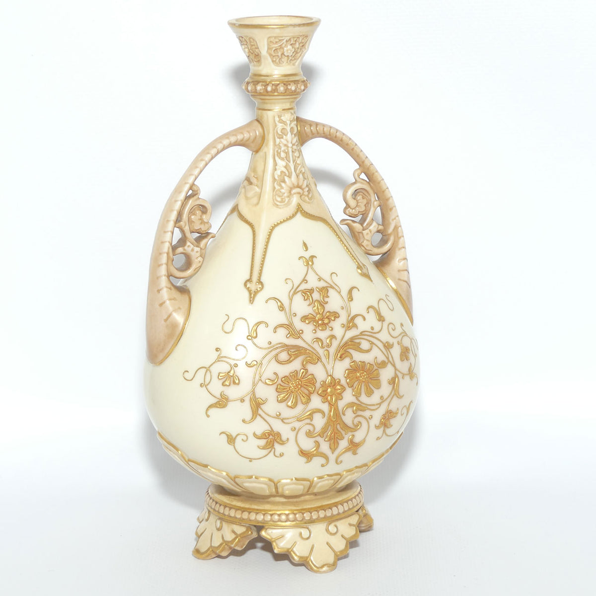 Royal Worcester Blush Ivory heavily gilt handled vase on quad feet