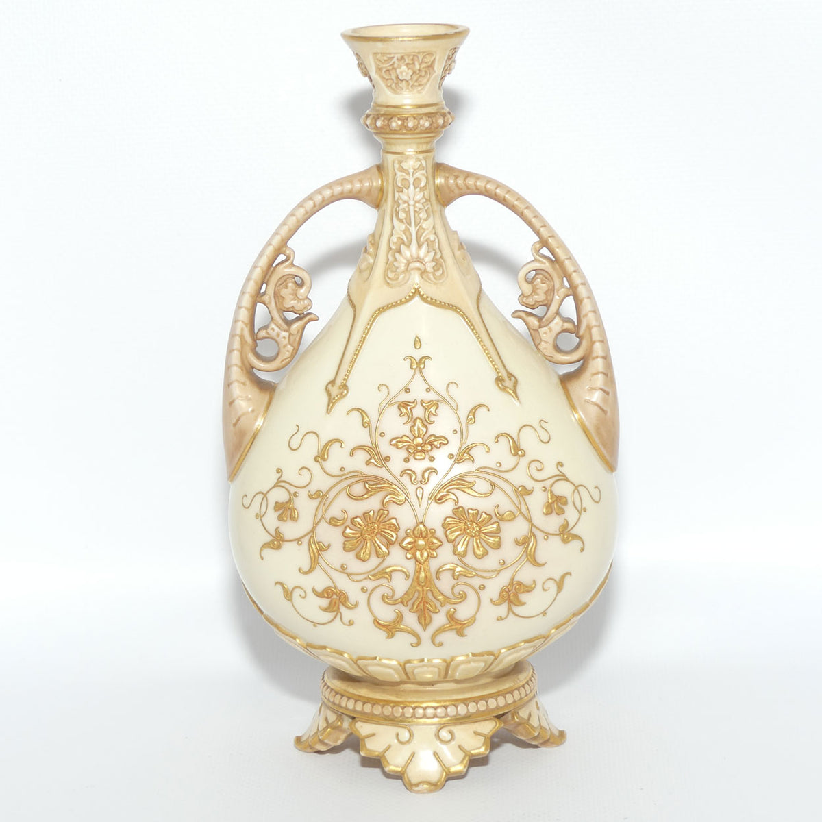 Royal Worcester Blush Ivory heavily gilt handled vase on quad feet