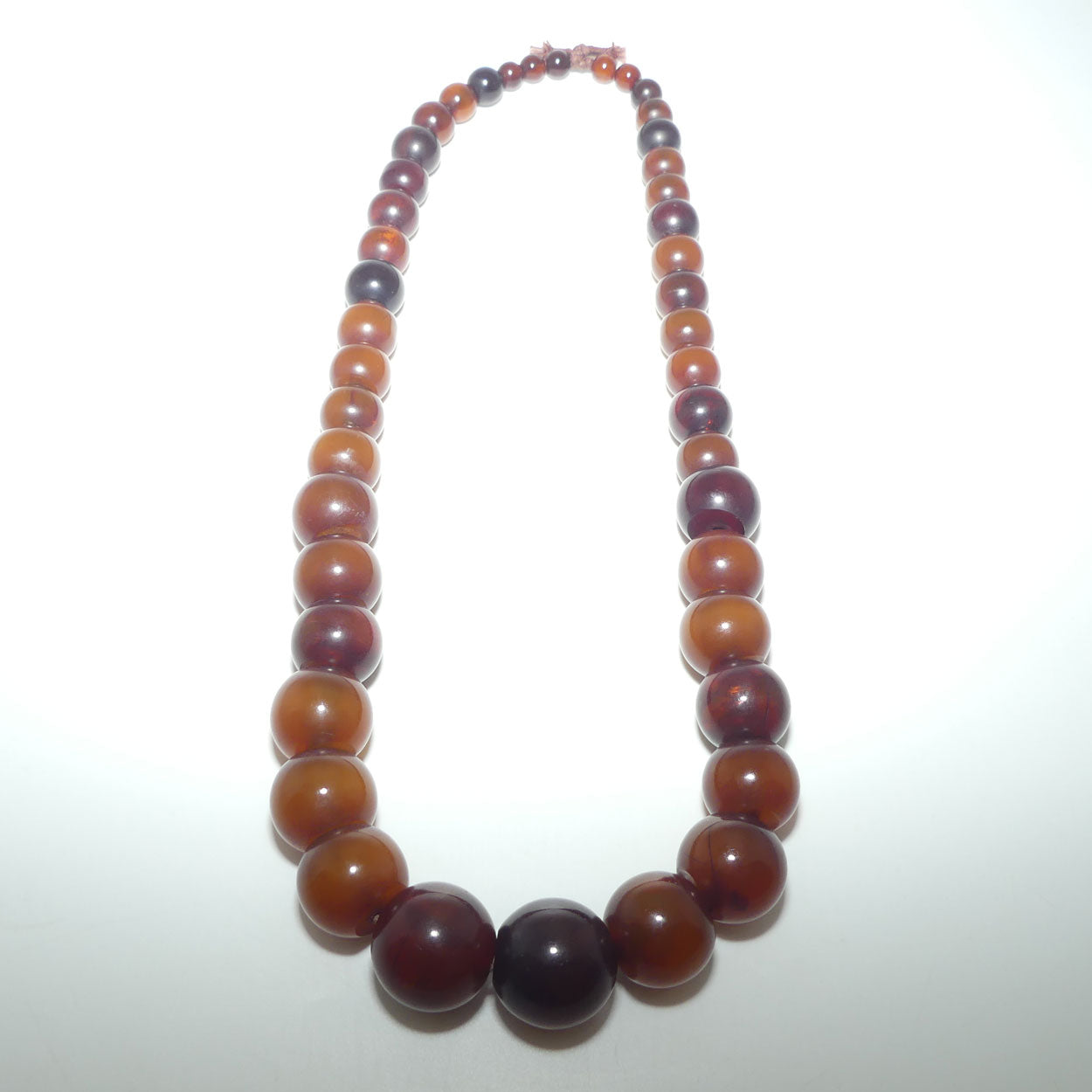 Very Heavy Antique set of Cognac Amber beads - strung on cord | 70cm total length