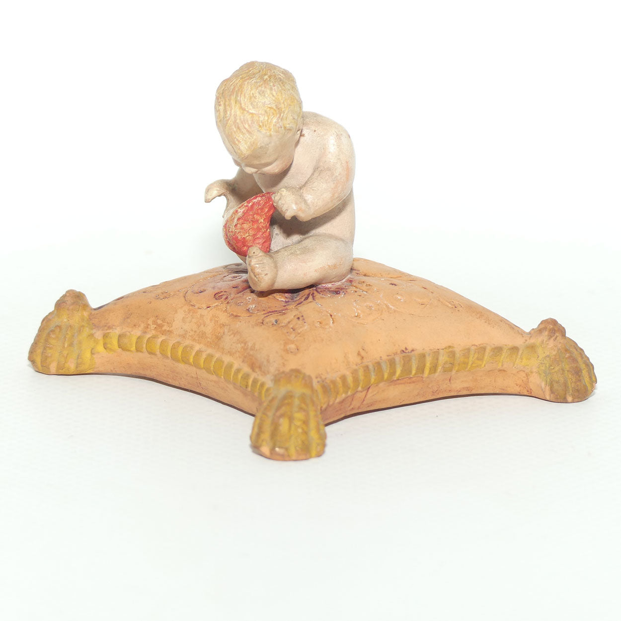 P. Ipsens Eneret terracotta figure of a baby on cushion | 442