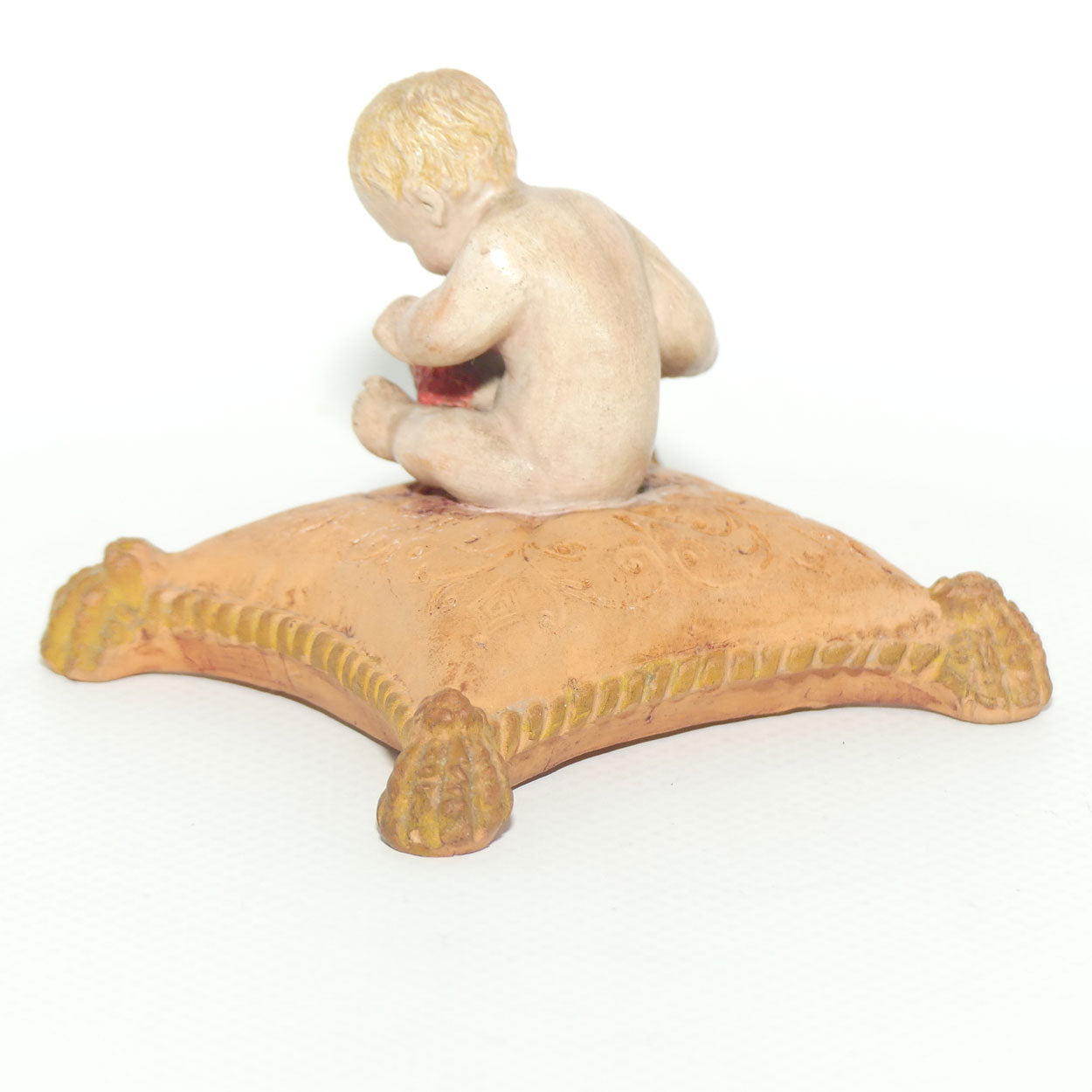 P. Ipsens Eneret terracotta figure of a baby on cushion | 442