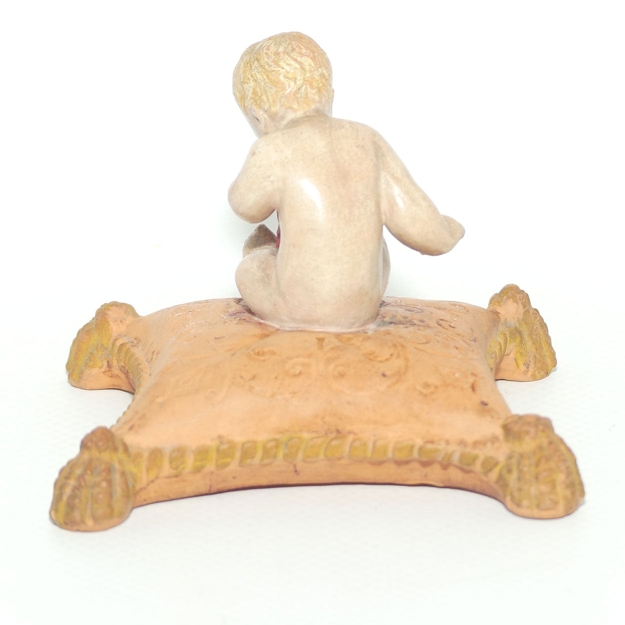 P. Ipsens Eneret terracotta figure of a baby on cushion | 442