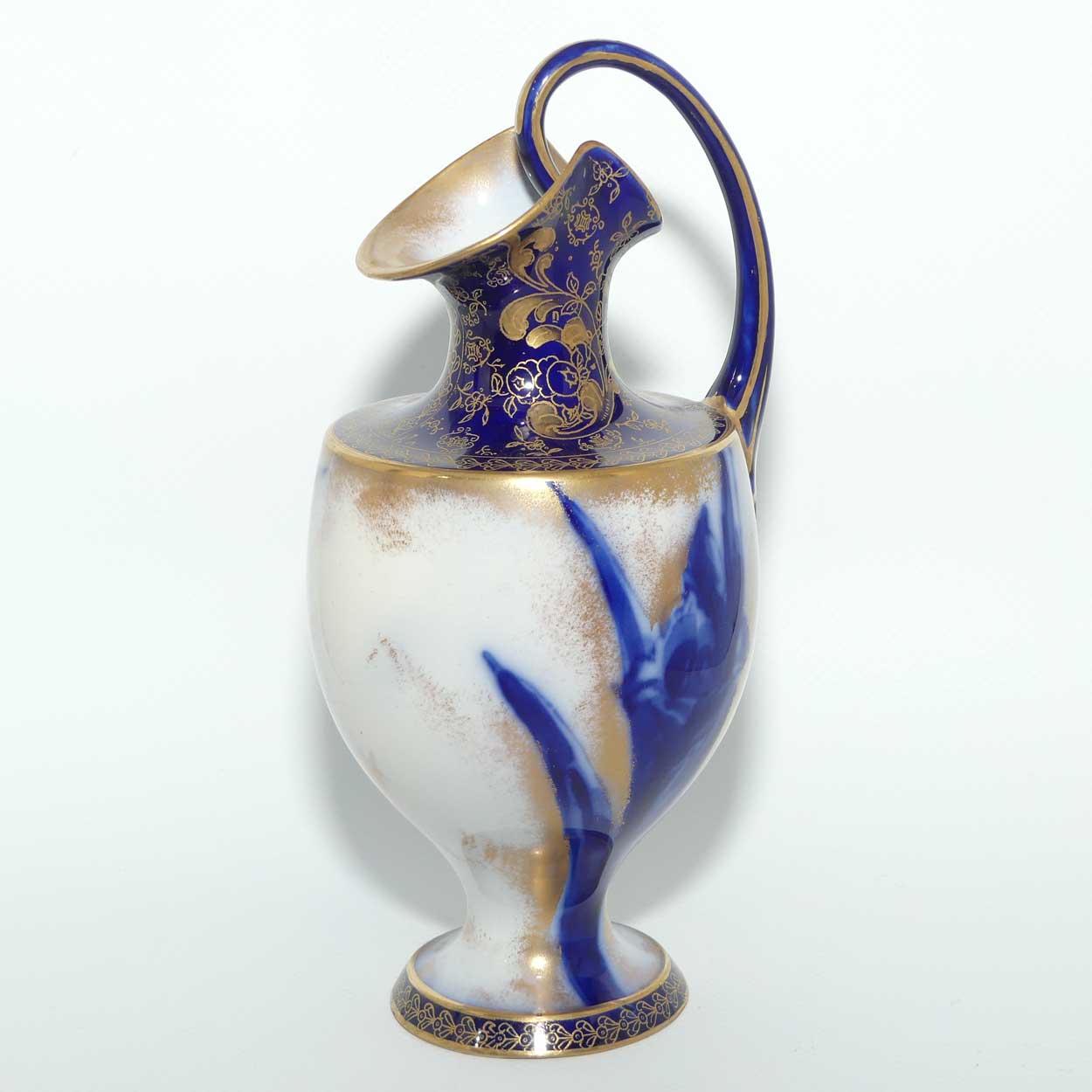 Doulton Burslem Blue Iris and Daffodil loop handle jug with gilt highlights