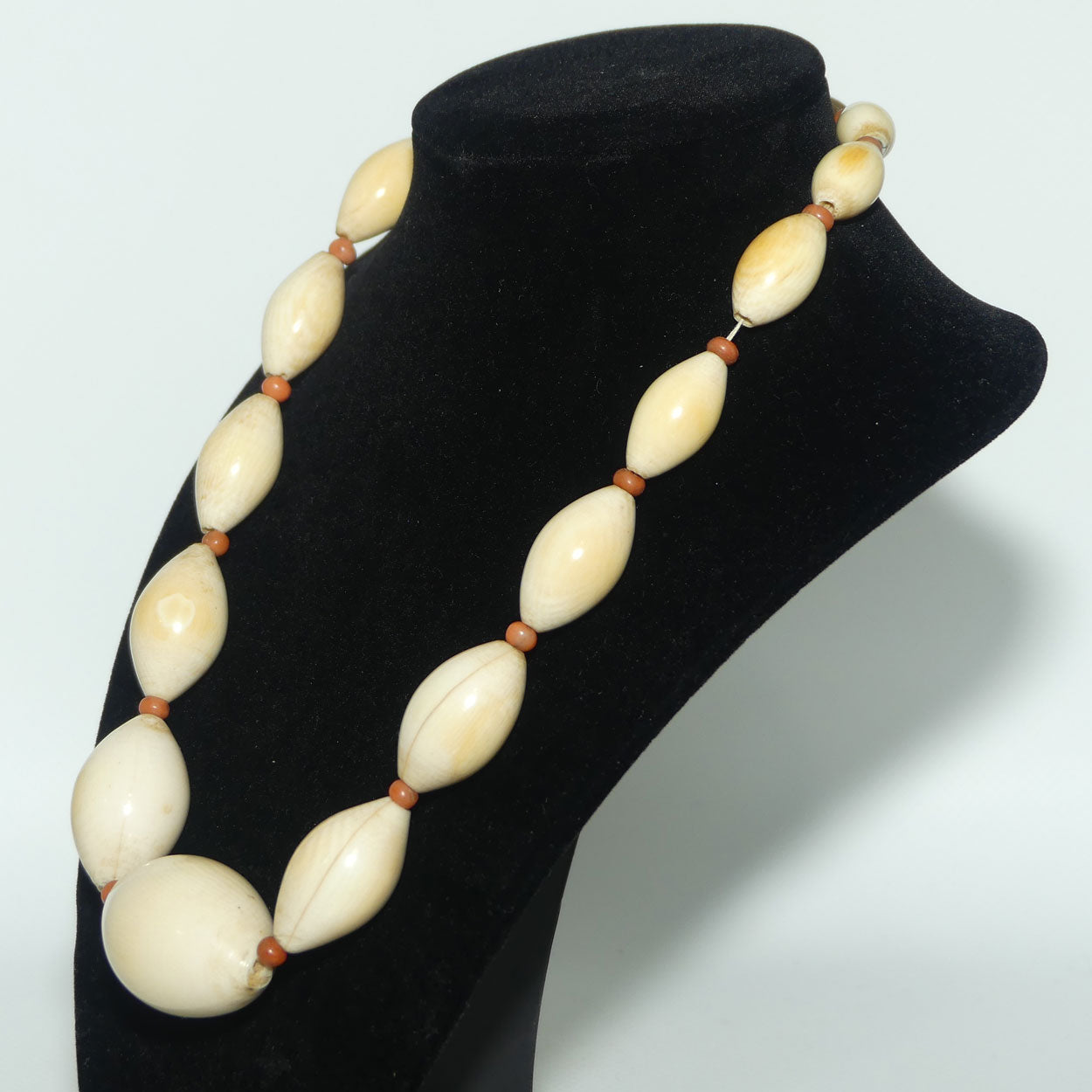 Very Heavy Antique set of Graduated Elongated Ivory Beads with feature Coral beads