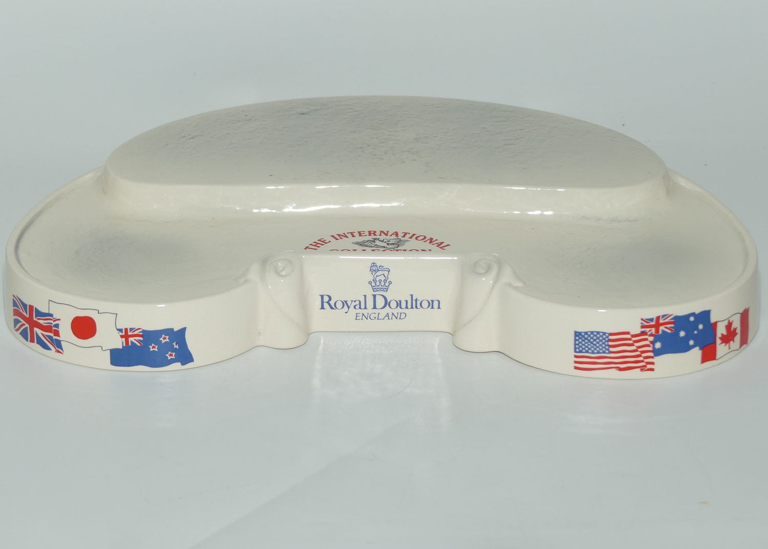 D- Royal Doulton small character jug The International Collection jug or liquor container stand