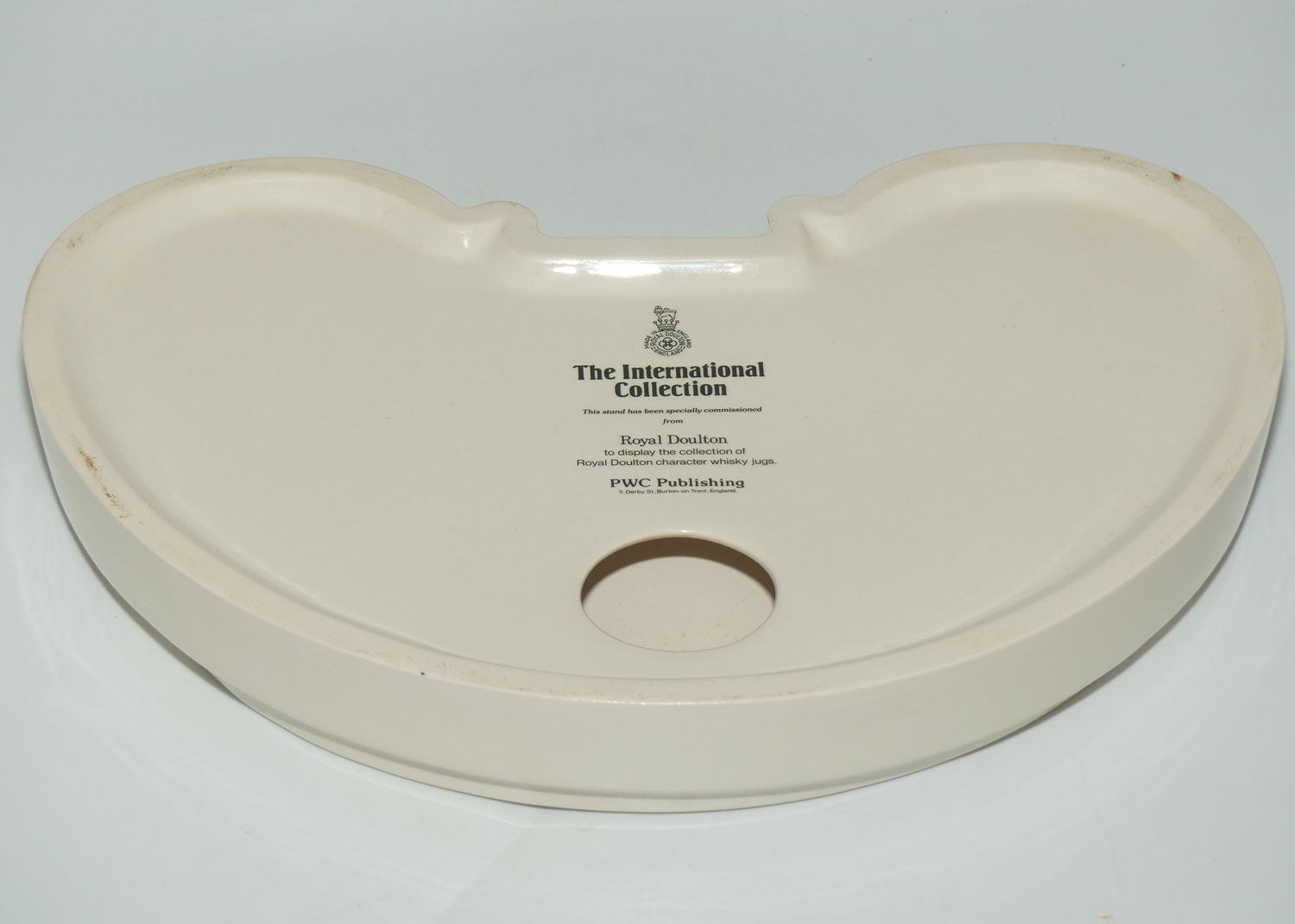 D- Royal Doulton small character jug The International Collection jug or liquor container stand