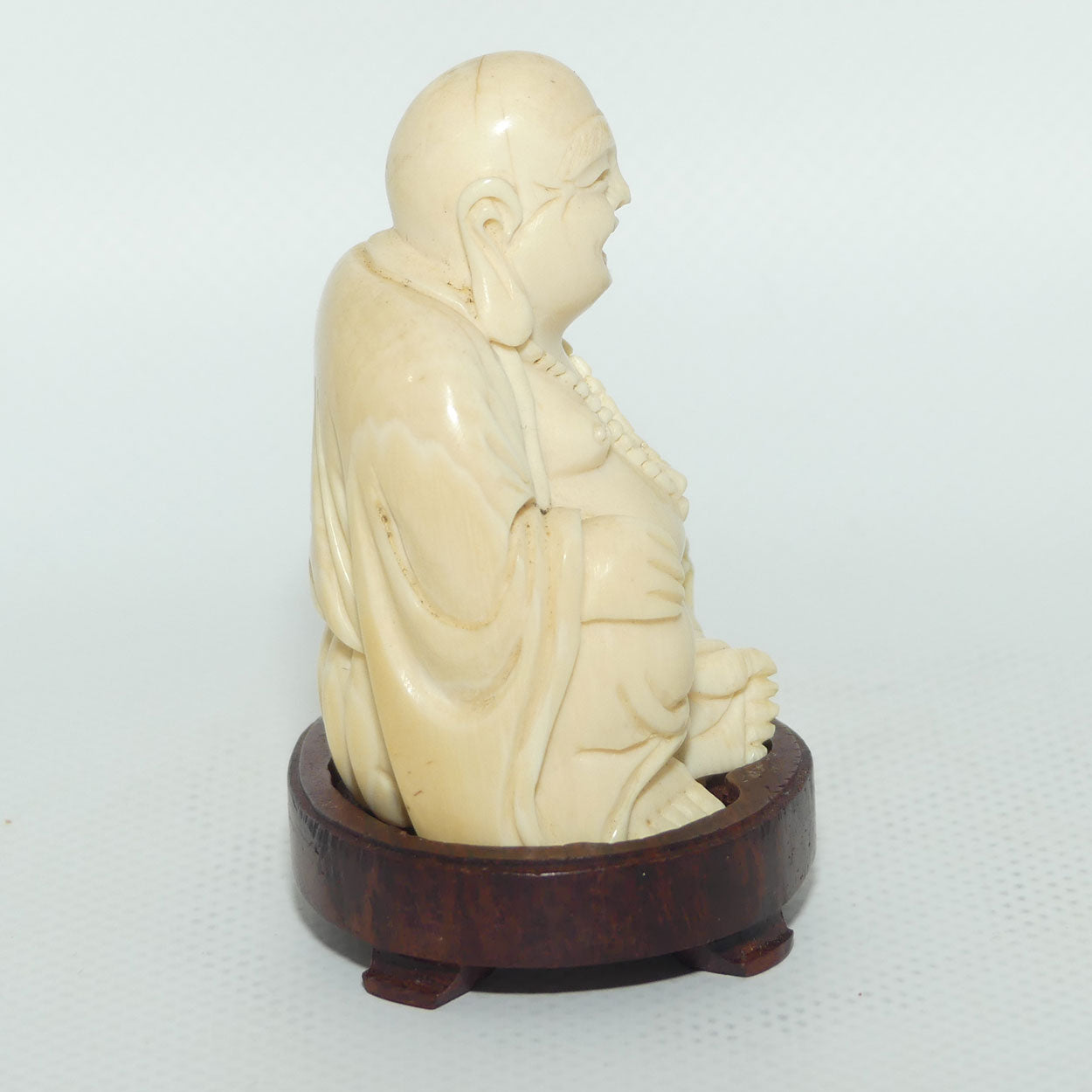 Beautifully carved Ivory Laughing Buddha Seated on Wooden Stand | signed | 7.5cm tall