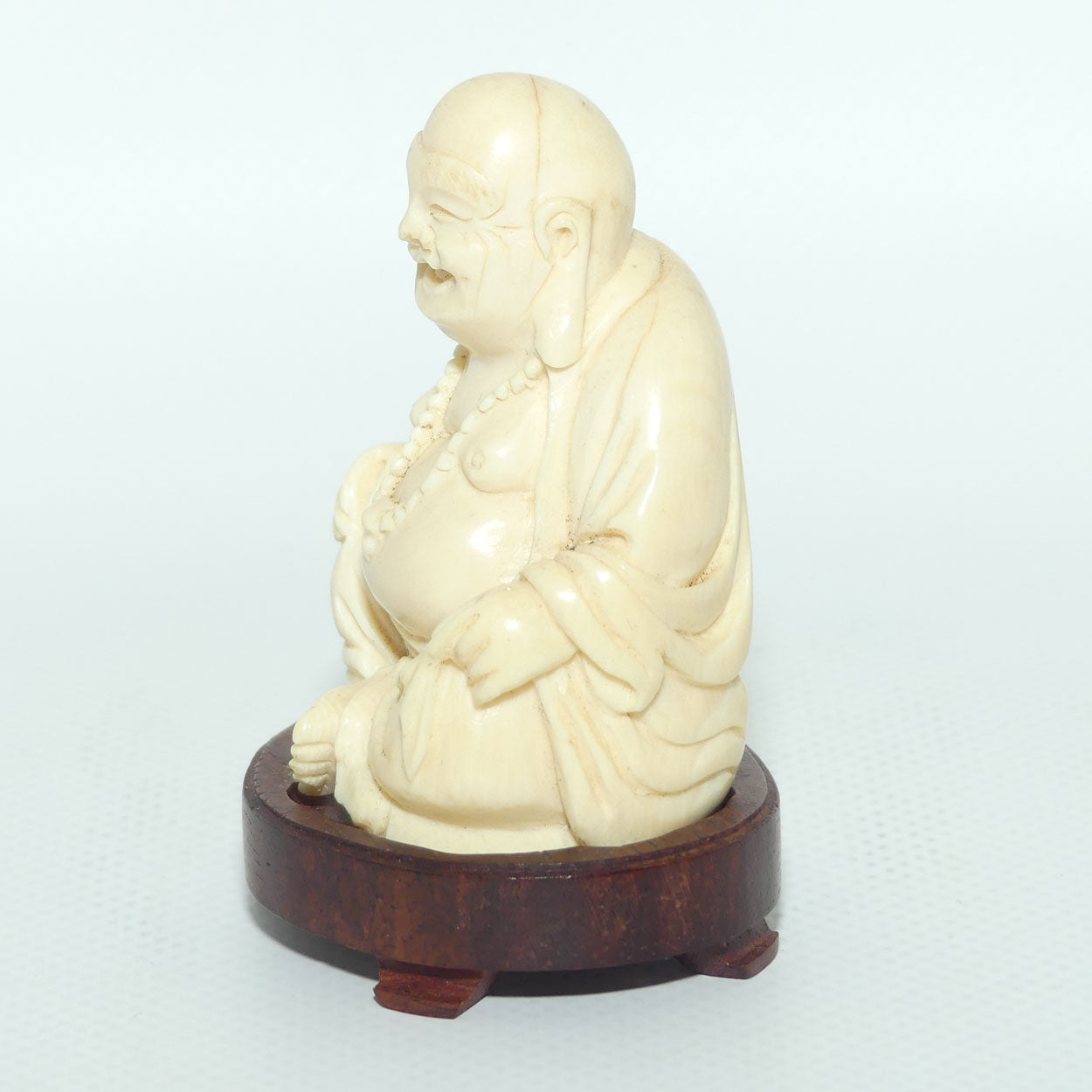 Beautifully carved Ivory Laughing Buddha Seated on Wooden Stand | signed | 7.5cm tall