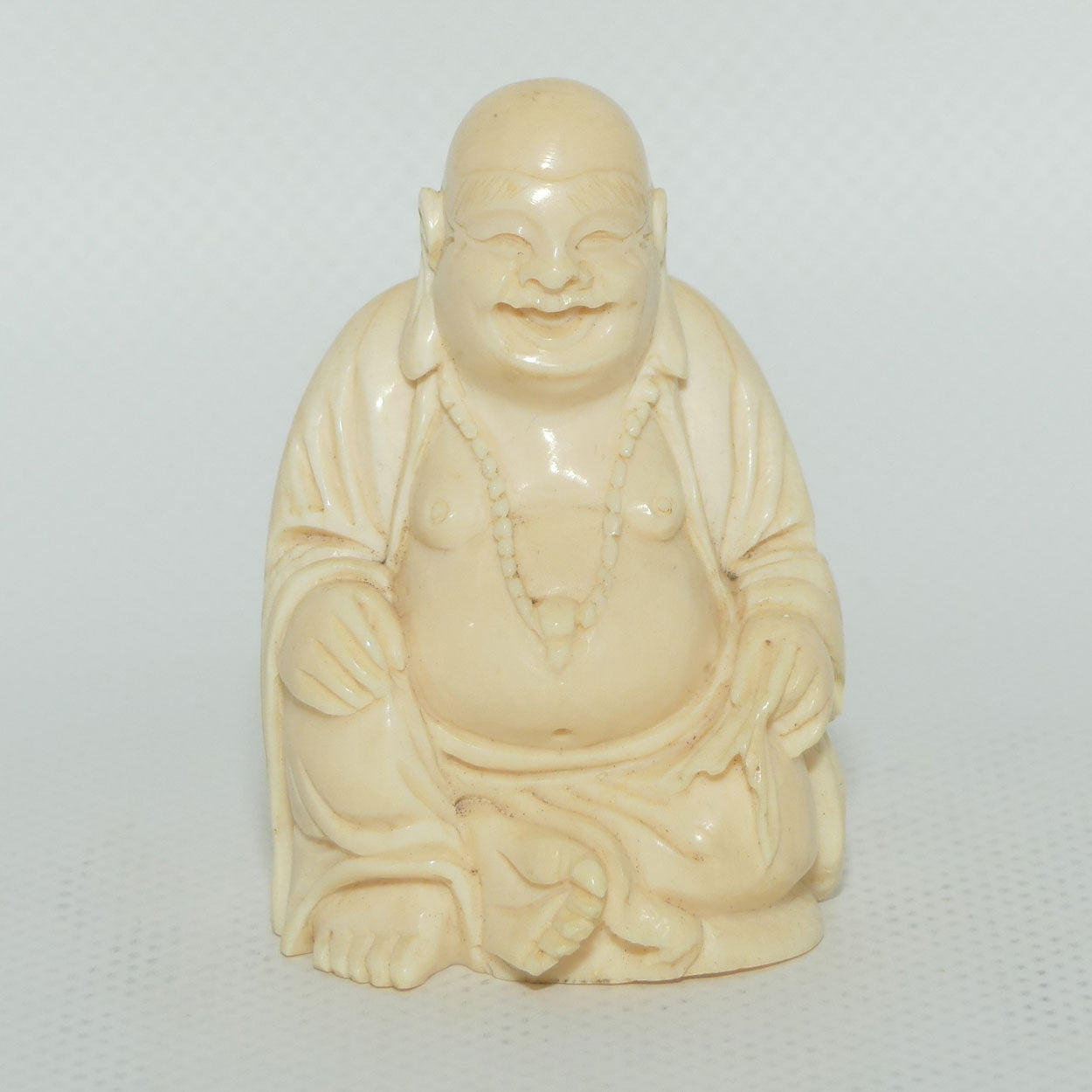 Beautifully carved Ivory Laughing Buddha Seated on Wooden Stand | signed | 7.5cm tall