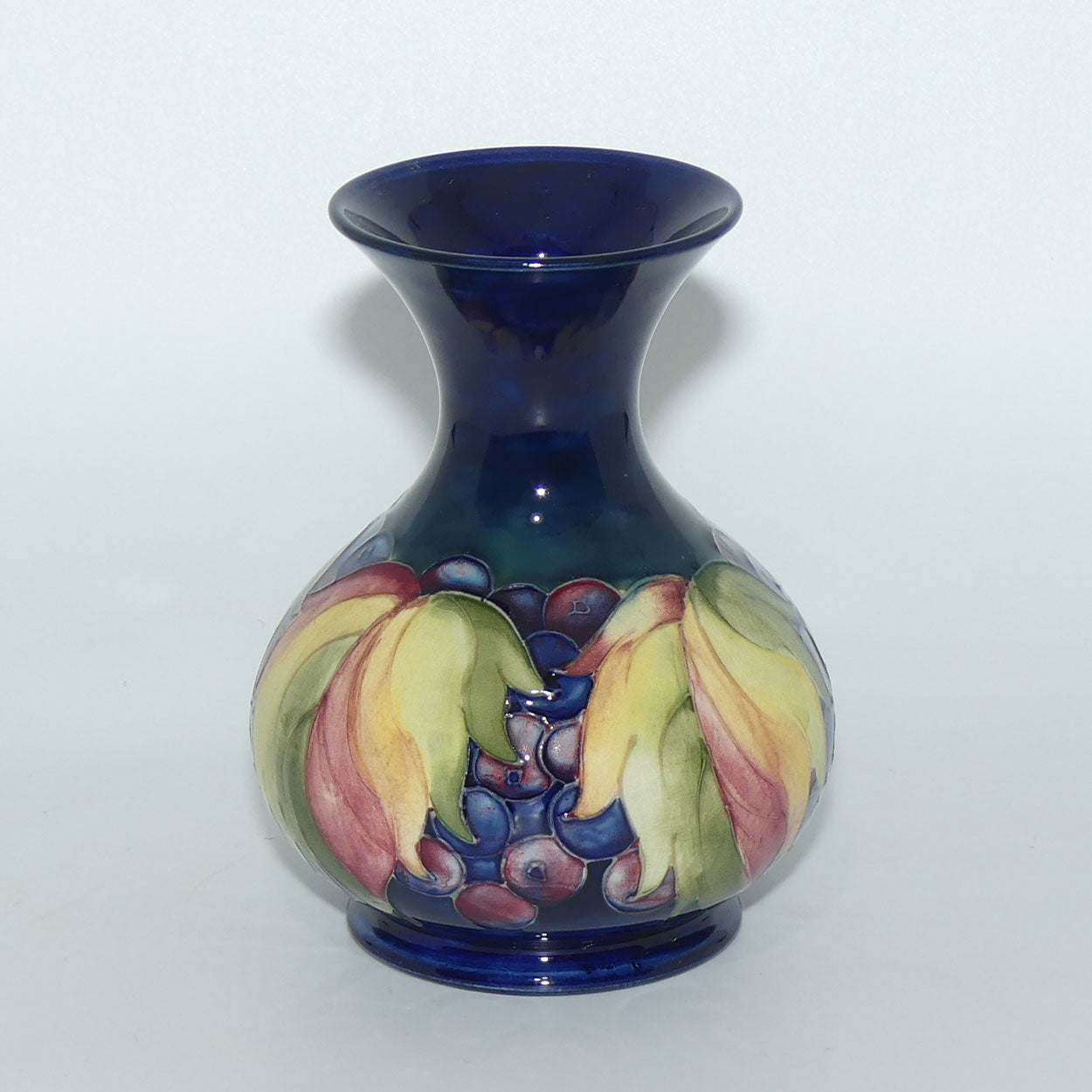 William Moorcroft Leaves and Fruit (Blue) flaired mouth vase