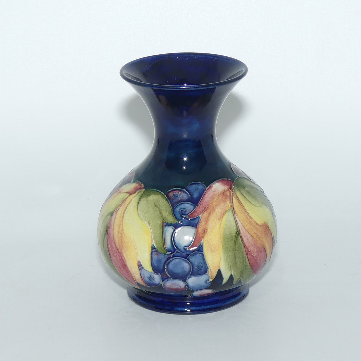 William Moorcroft Leaves and Fruit (Blue) flaired mouth vase