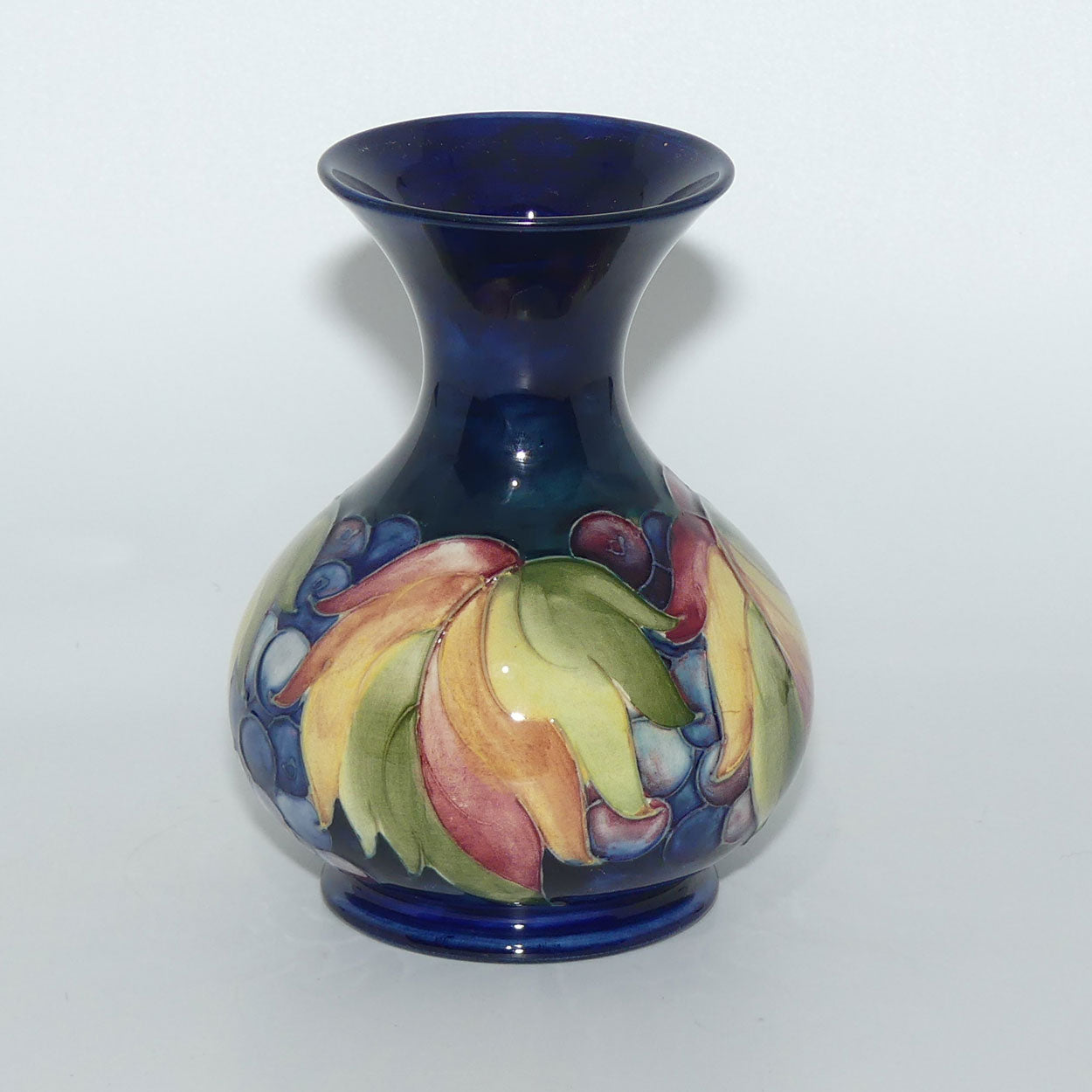 William Moorcroft Leaves and Fruit (Blue) flaired mouth vase