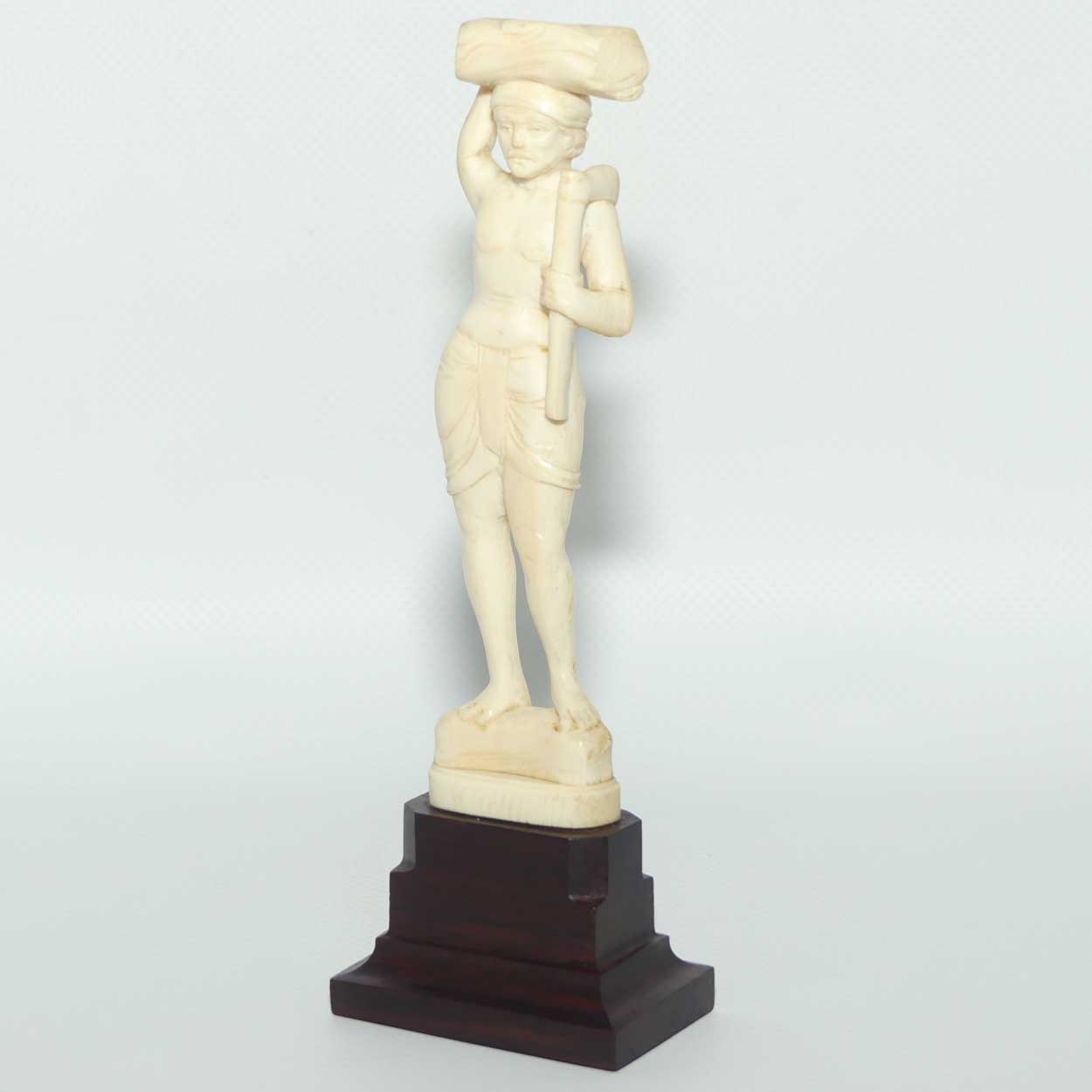 Carved Ivory Figure on Rosewood base | Man with Axe Carrying Log on Head | 17cm