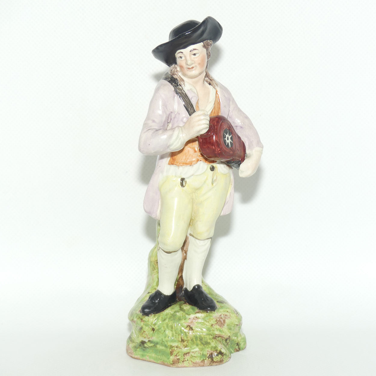 19th Cent English Pottery Man in Hat Carrying Instrument